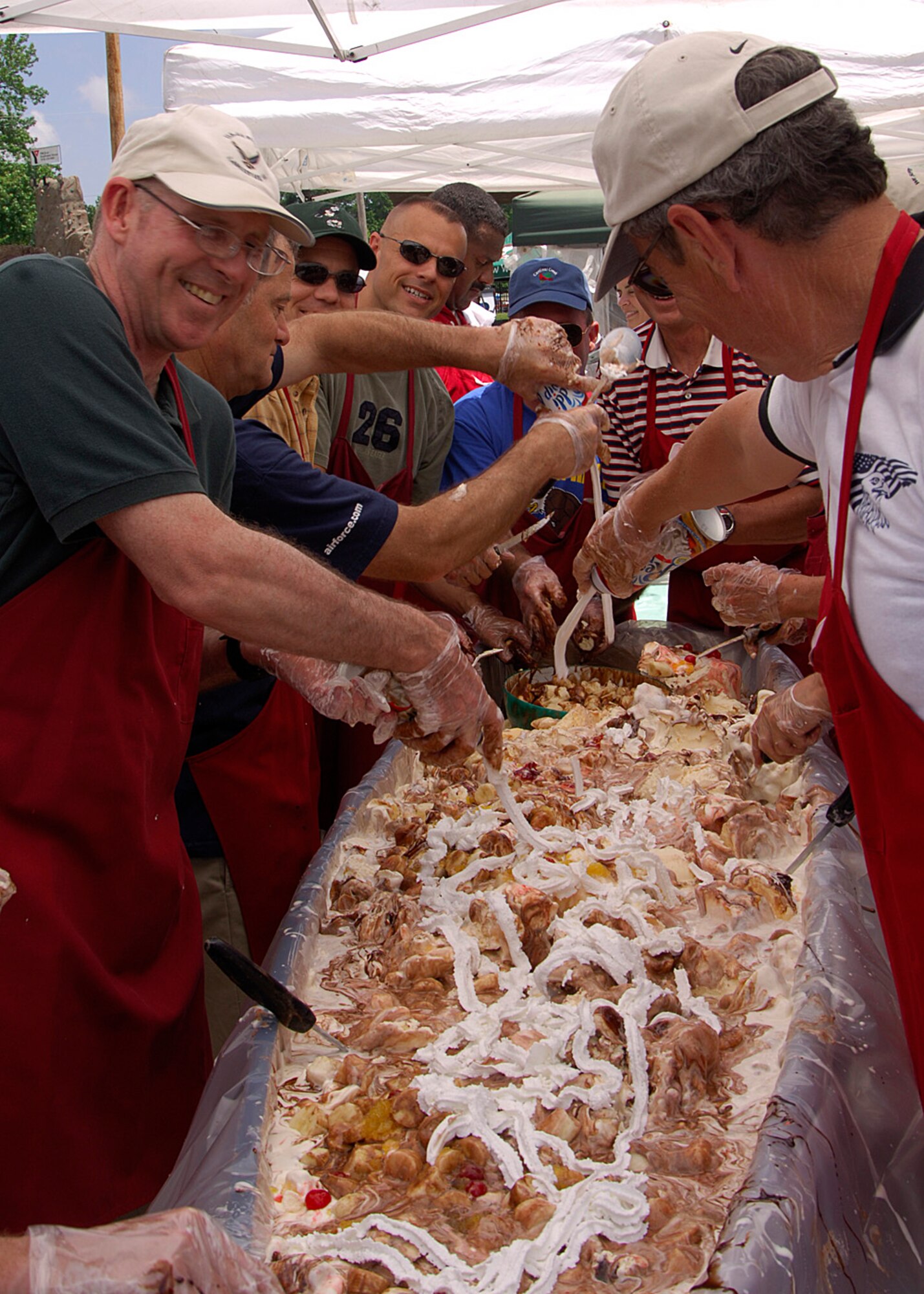 SCOTT AIR FORCE BASE, Ill. -- Members of Scott Air Force Base and the City of O’Fallon make a six foot banana split at the O’Fallon Salute to Scott picnic held June 14. The annual picnic is put on by the O’Fallon chamber of commerce and the City of O’Fallon to show support to the military and civilian members of Scott Air Force Base. It also serves to bring the city of O’Fallon and its residents closer together with those that live and work on the base.
(U.S. Air Force photo/Airman 1st Class Wesley Farnsworth)