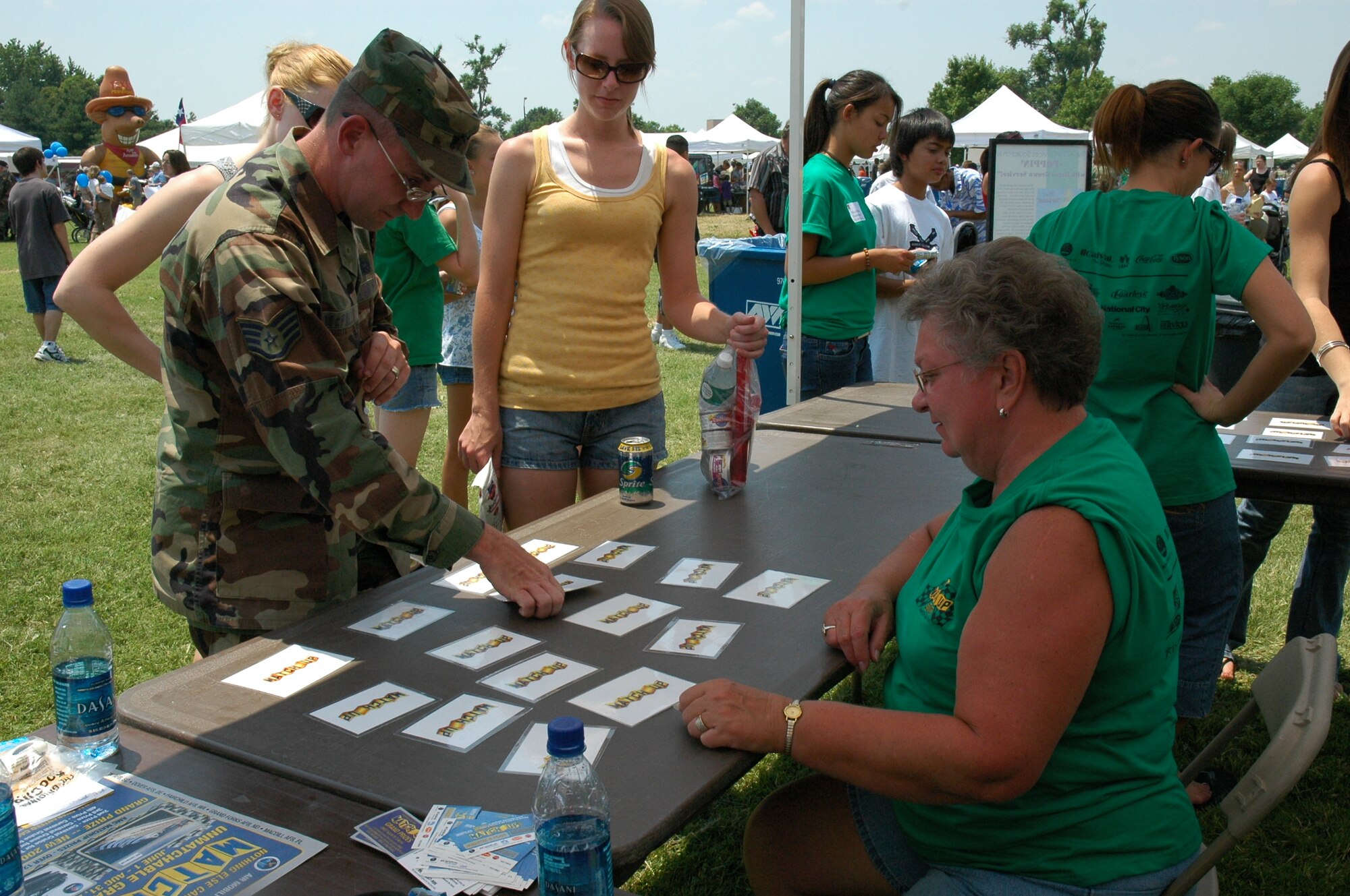 SCOTT AIR FORCE BASE, Ill. -- 375th Services Squadron employee Donna Kehrer assists picnic attendees in playing the Match-up game which is similar to concentration.
courtesy photo