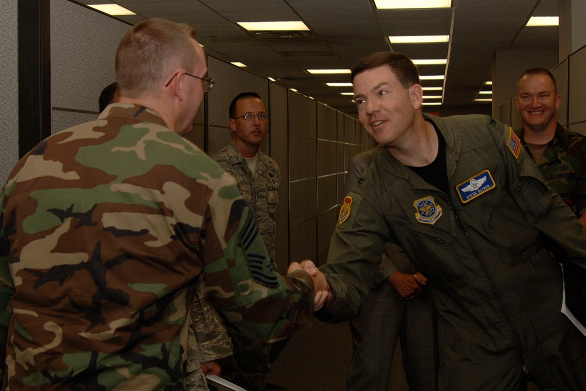 SCOTT AIR FORCE BASE, Ill. -- Col Stephen Oliver, incoming 375th Airlift Wing commander, greets members of the 375th Communications Support Squadron on June 9. Col Oliver is touring the Wing to give members of JTF Scott the opportunity to meet the new commander.
(U.S. Air Force photo/Senior Airman Kristin capps)
