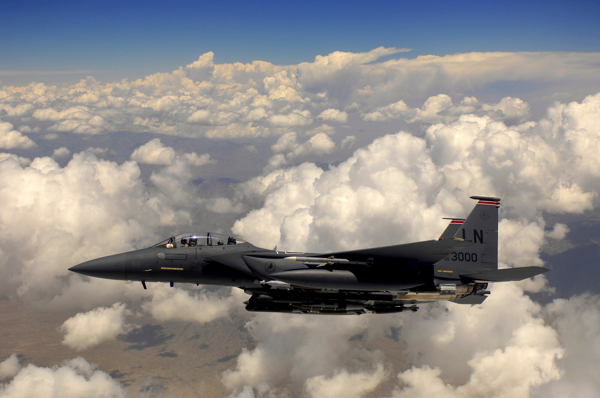 An Air Force F-15E Strike Eagle aircraft waits for his wingman after receiving fuel from a KC-135R Stratotanker during a mission over Afghanistan. F-15E is deployed from Royal Air Force Lakenheath, England. (U.S. Air Force photo/Master Sgt. Andy Dunaway)  
