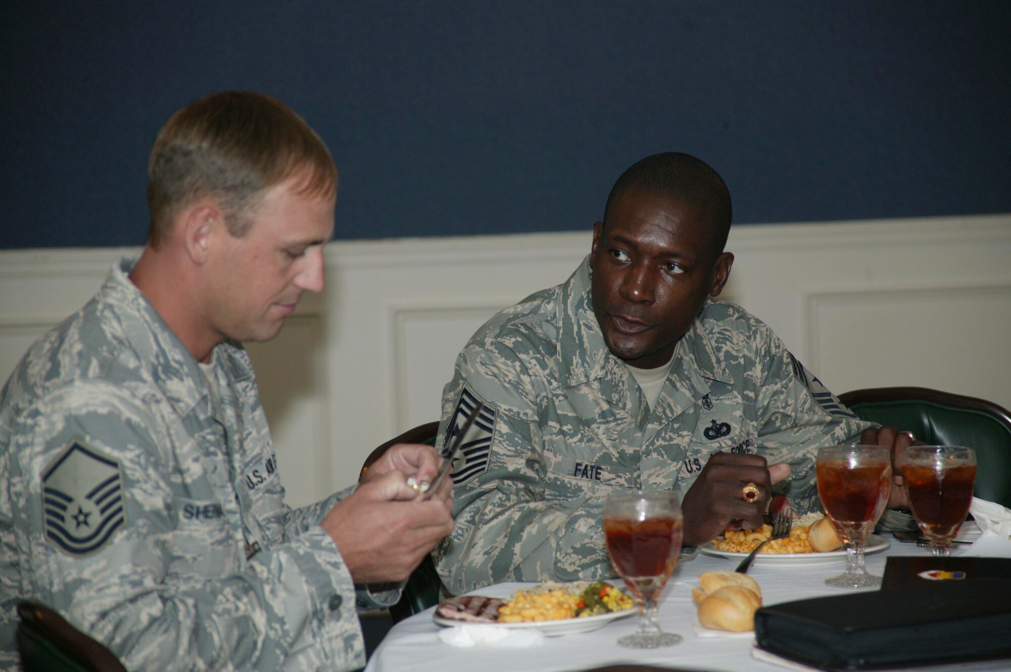 SHAW AIR FORCE BASE, S.C.-- Chief Master Sgt. Lefford Fate, 20th Fighter Wing command chief, (right) talks with Master Sgt. John Sherman, 20th Medical Group, during a 20th MDG top four luncheon June 17 at the Carolina Skies Club. Chief Fate is now responsible for military standards, morale welfare, training, professional development and good order and discipline of more than 4,300 enlisted personnel assigned to the largest F-16 fighter wing in the combatant air forces. (U.S. Air Force photo/Staff Sgt. Holly Brown)
