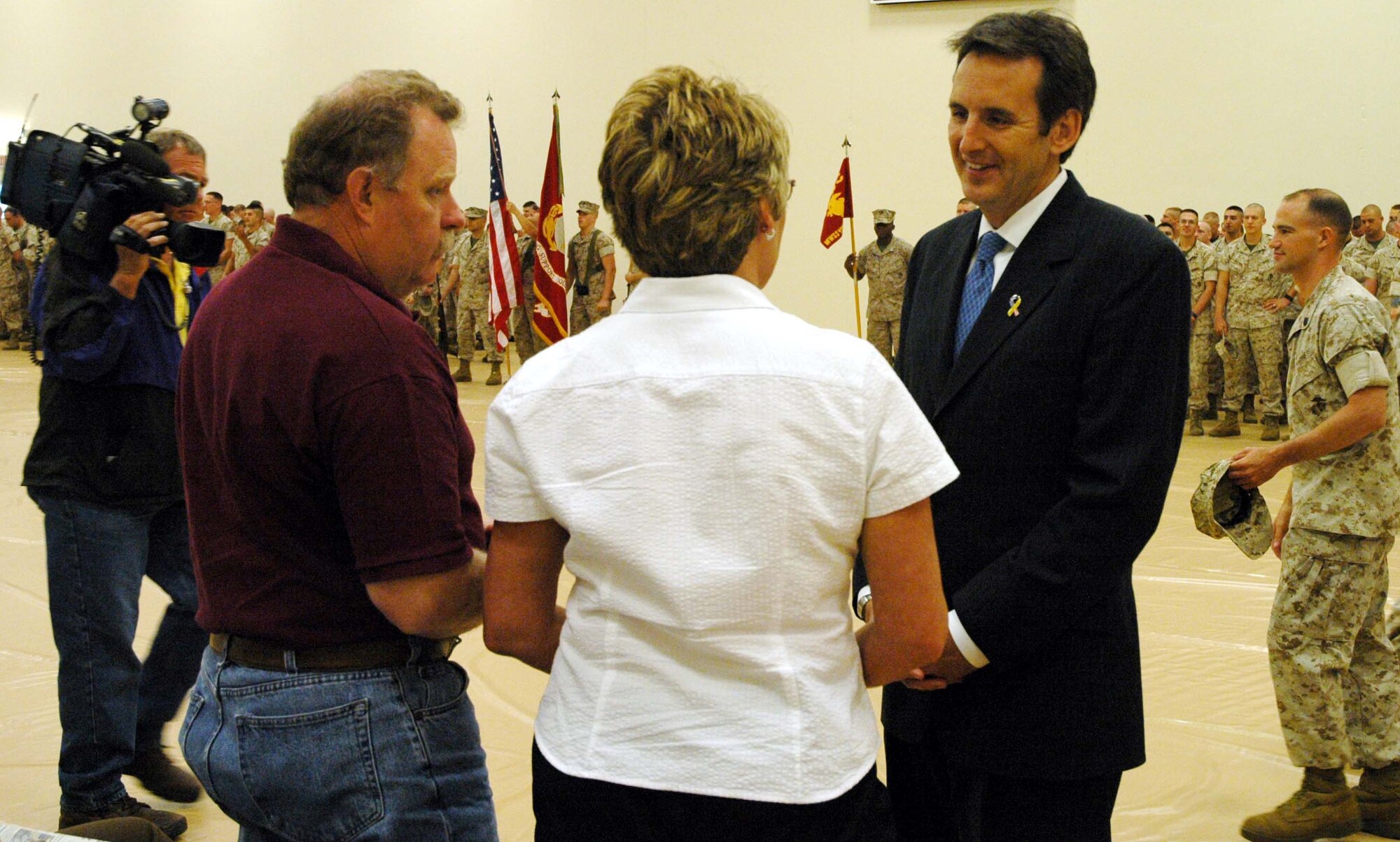 Governor Tim Pawlenty talks with Marine family members at a deployment ceremony at Minneapolis St. Paul International Airport Air Reserve Station Monday.  More than 200 members of Marine Wing Support Squadron 471 departed for Camp LeJeune, North Carolina until September and will then head overseas to the African nation of Djibouti. They'll be there until March, supporting Operation ENDURING FREEDOM. Air Force Photo/Master Sgt. Paul Zadach.

