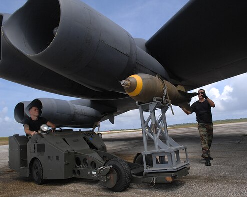 Maintainers from the 2nd Bomb Wing at Barksdale Air Force Base, La., work on a B-52 Stratofortress bomber on the flightline at Andersen AFB, Guam. The bomber's presence there enhances regional security, demonstrates U.S. commitment to the Pacific region and provides integrated training opportunities for deployed Airmen. (U.S. Air Force photo/Staff Sgt. Vanessa Valentine) 