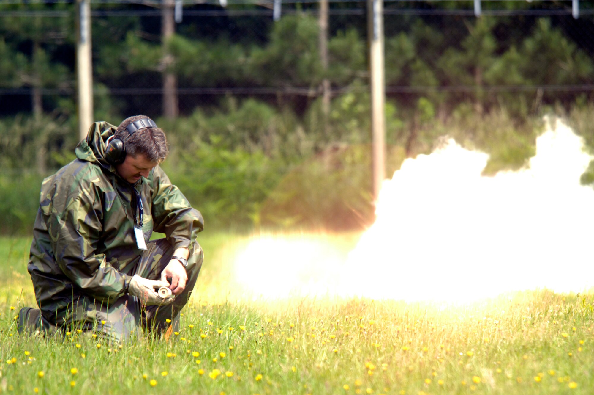 Master Sgt. William Ogle, 48th Fighter Wing Inspection, Exercises and Readiness Division, prepares a simulated explosion grenade, Jun 12 at RAF Lakenheath. A number of agencies participated in an emergency management exercise, simulating an F-15C crash. (U.S. Air Force photo by Airman Perry Aston)