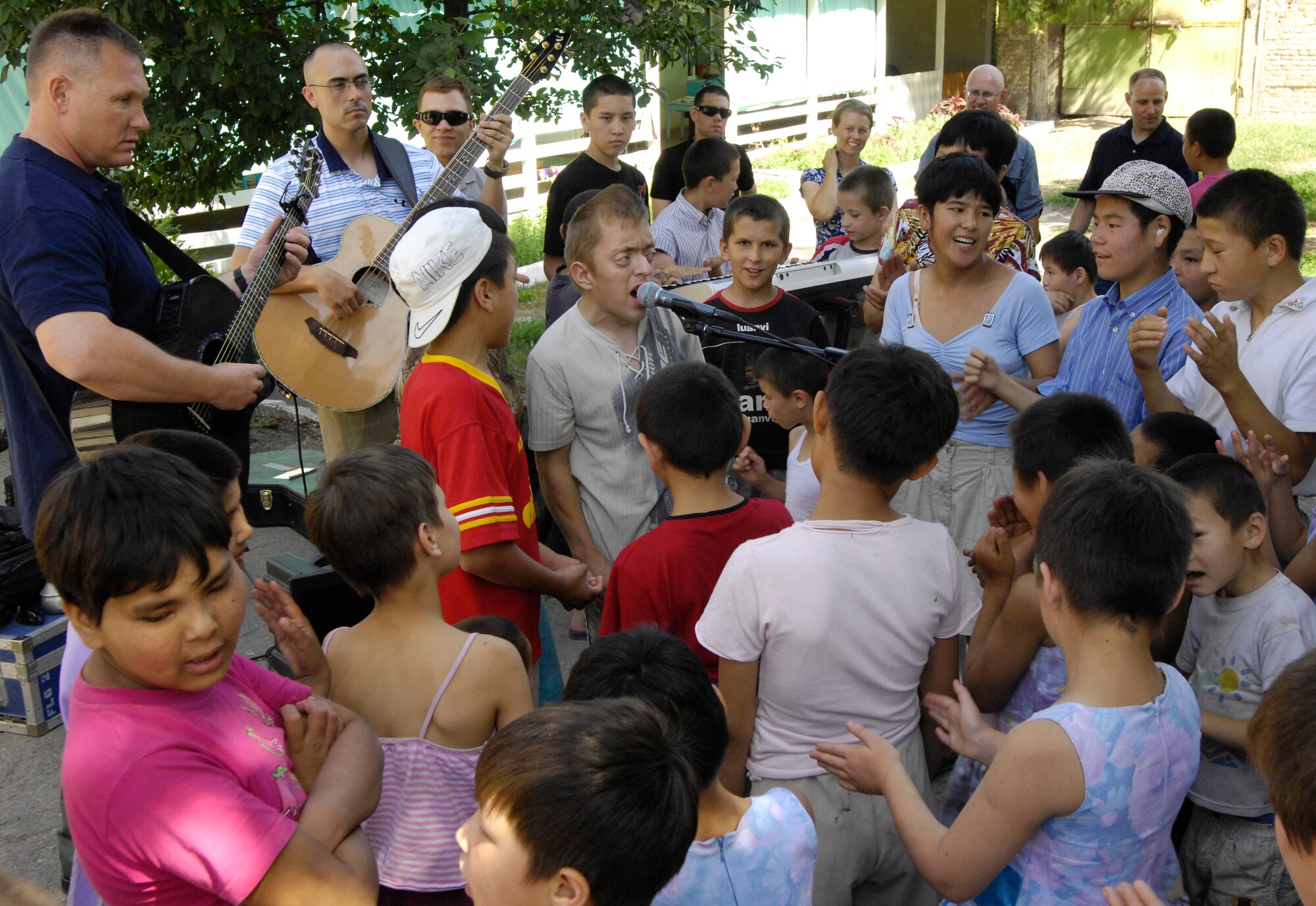 (08/06/14) The children of the Belovodosky Orphanage, Kyrgyz Republic, sing some of their favorite Russian military songs for the The U.S. Air Forces Central Band, Falcon.  (U.S. Air Force by Staff Sgt. Tabitha Kuykendall/ Released)