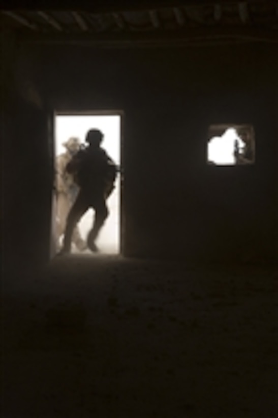 U.S. Marines clear an abandoned house in the Al Anbar province of Iraq on June 11, 2008.  The Marines are assigned to 2nd Platoon, Delta Company, 2nd Light Armored Reconnaissance Battalion, a ground combat element attached to Task Force Mechanized, Multi-National Force - West.  