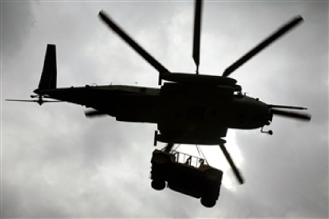 A CH-53E Super Stallion helicopter assigned to the 26th Marine Expeditionary Unit's Marine Medium Helicopter Squadron 264 Reinforced lifts a humvee during a realistic urban training exercise on Camp Atterbury, Ind., June 13, 2008. The 26th MEU is conducting pre-deployment training and will deploy later this year. 