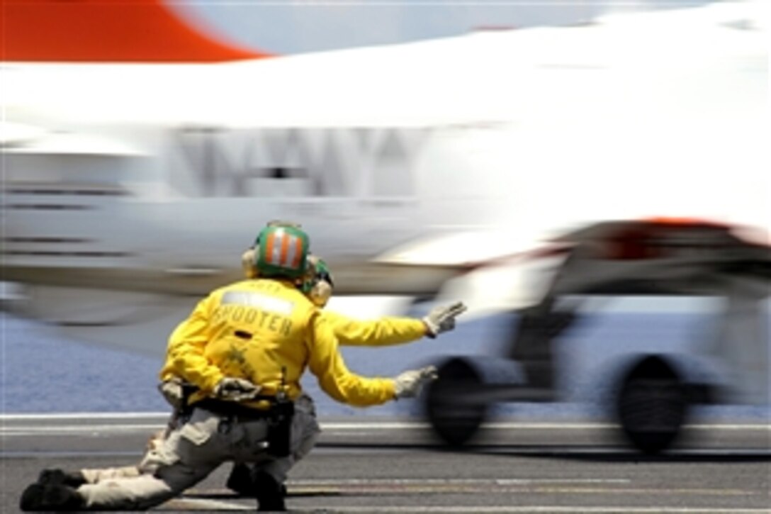 U.S. Navy Lt. Cmdr. Eric Hanks and Lt. Derrick Eastwood shoot a T-45 Goshawk from a catapult during flight operations aboard the aircraft carrier USS Theodore Roosevelt, Atlantic Ocean, June 12, 2008. 