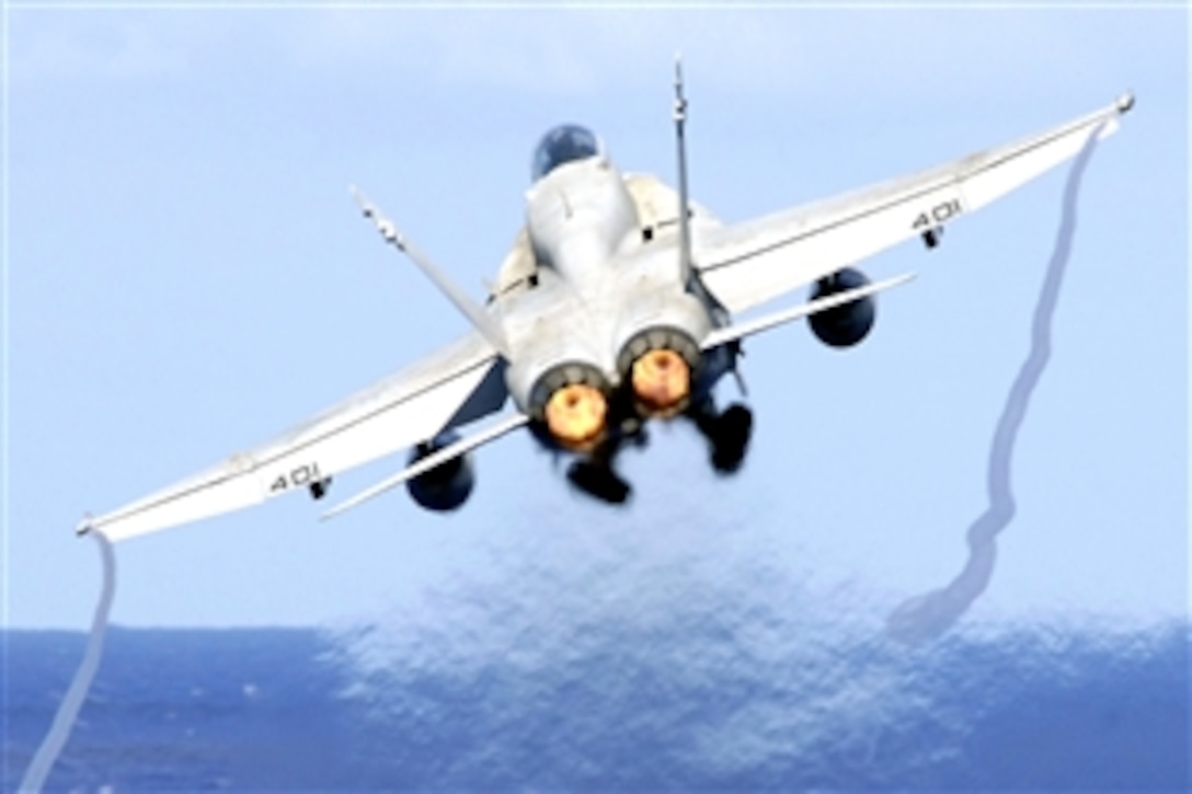 An F/A-18C Hornet assigned to Strike Fighter Squadron 195 launches from the flight deck of the aircraft carrier USS Kitty Hawk, Pacific Ocean, June 15, 2008. The USS Kitty Hawk is returning to the United States for decommissioning after 47 years of service, 10 of which have been in Japan. It will be replaced this summer by the aircraft carrier USS George Washington. 