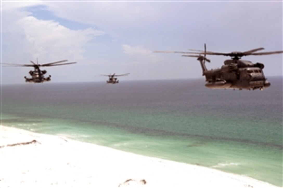 Three MH-53 Pave Low helicopters assigned to the Air Force's 20th Special Operations Squadron fly over the Gulf of Mexico, June 12, 2008, during a five-ship formation. The helicopters are assigned to Hurlburt Field, Florida. 