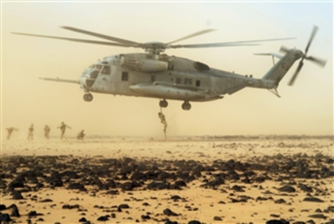 U.S. Air Force pararescuemen conduct a fast rope exercise from a CH-53 Stallion helicopter in Djibouti on June 9, 2008.  The pararescuemen are from the 82nd Expeditionary Rescue Squadron from Davis-Monthan Air Force Base, Ariz.  