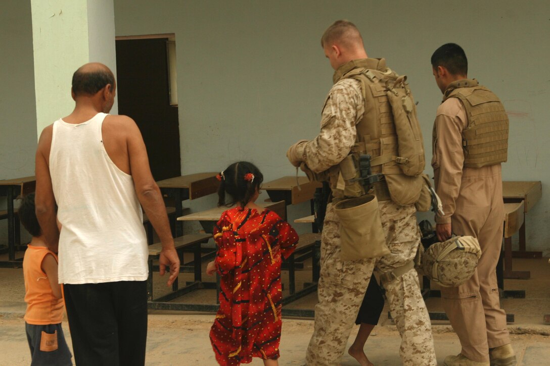 Staff Sgt. Earl Lucas, a platoon sergeant with Regimental Combat Team 1, assesses a school in downtown Ramadi for structural damage and faulty utilities June 18. The country is now transitioning from violence and fighting to healing and freedom from strife. The focus in Ramadi, and all of al Anbar Province, is no longer on warfare but on rebuilding the region's damaged infrastructure. "Ramadi is at the point now to where it's secure enough to begin rebuilding," Lucas said.