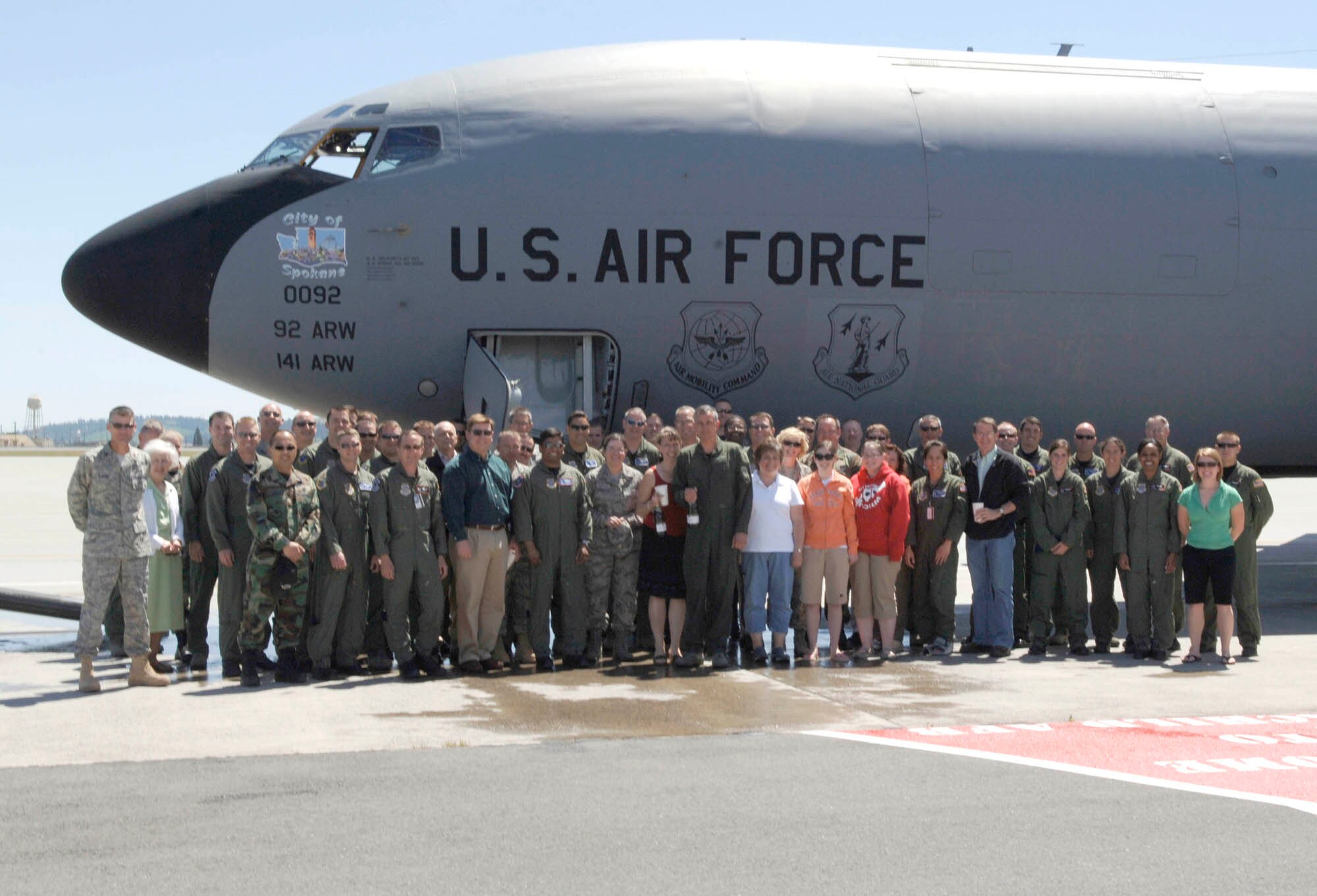 FAIRCHILD AIR FORCE BASE, Wash. – Col. Roger Watkins, 92nd Air Refueling Wing vice commander, poses with a crowd of family and friends after taking his final KC-135 Stratotanker flight here June 18. (U.S. Air Force photo / Airman 1st Class Darlene West)
