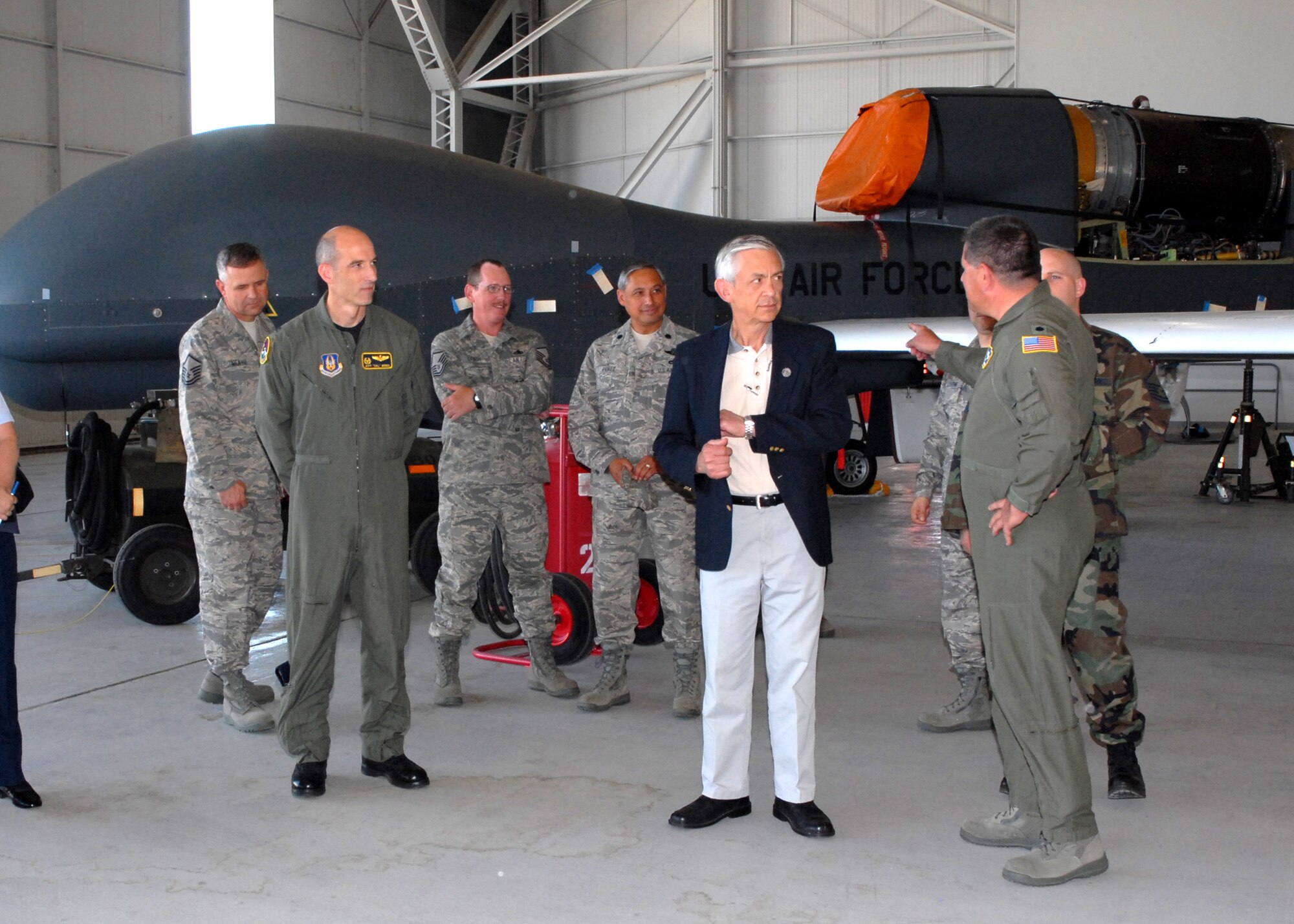 The Honorable Craig Duehring (center), Assistant Secretary of Air Force Manpower and Reserve Affairs, is shown the RQ-4 Global Hawk, an unmanned high altitude reconnaissance aircraft, by Air Force Reservists from the 13th Reconnaissance Squadron, at Beale Air Force Base, Calif. The secretary visited both the active duty and Reserve at Beale June 12 and 13, 2008. This was his first visit to the base.  (U.S. Air Force photo/Stacey Knott)