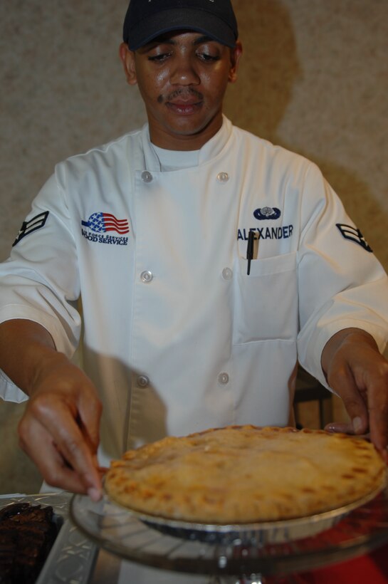 Airman 1st Class Azzid Alexander, 28th Force Support Squadron Food Services baker, sets apple pie out on the dessert line at the Ellsworth Air Force Base, S.D., Bandit Inn Dining Facility before the Airmen Appreciation Barbecue June 18, 2008. The meal included T-bone steak, barbecue ribs, barbecue chicken, macaroni and cheese, baked beans, corn on the cob and a dessert line. (U.S. Air Force photo/Airman 1st Class Joshua Seybert) 