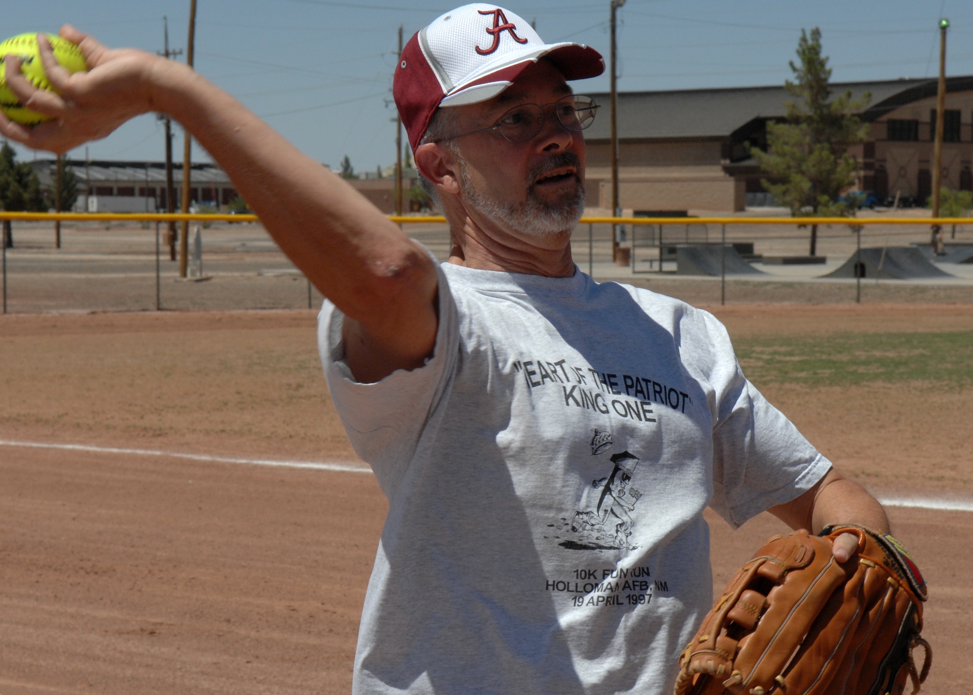 Mr. Bob Hudson warms up his arm by throwing the softball to a teammate before the 46th Test Group's Charity Softball Game June 12 on  Holloman Air Force Base, N.M.
Mr. Hudson is assigned to the 49th Force Support Squadron Manpower office. The charity game was in conjunction with their sports day. The 46th Test Group, military and civilians raised money for a local non- profit organization in the Alamogordo community.
(U.S. Air Force photo/Senior Airman Anthony Nelson Jr)
