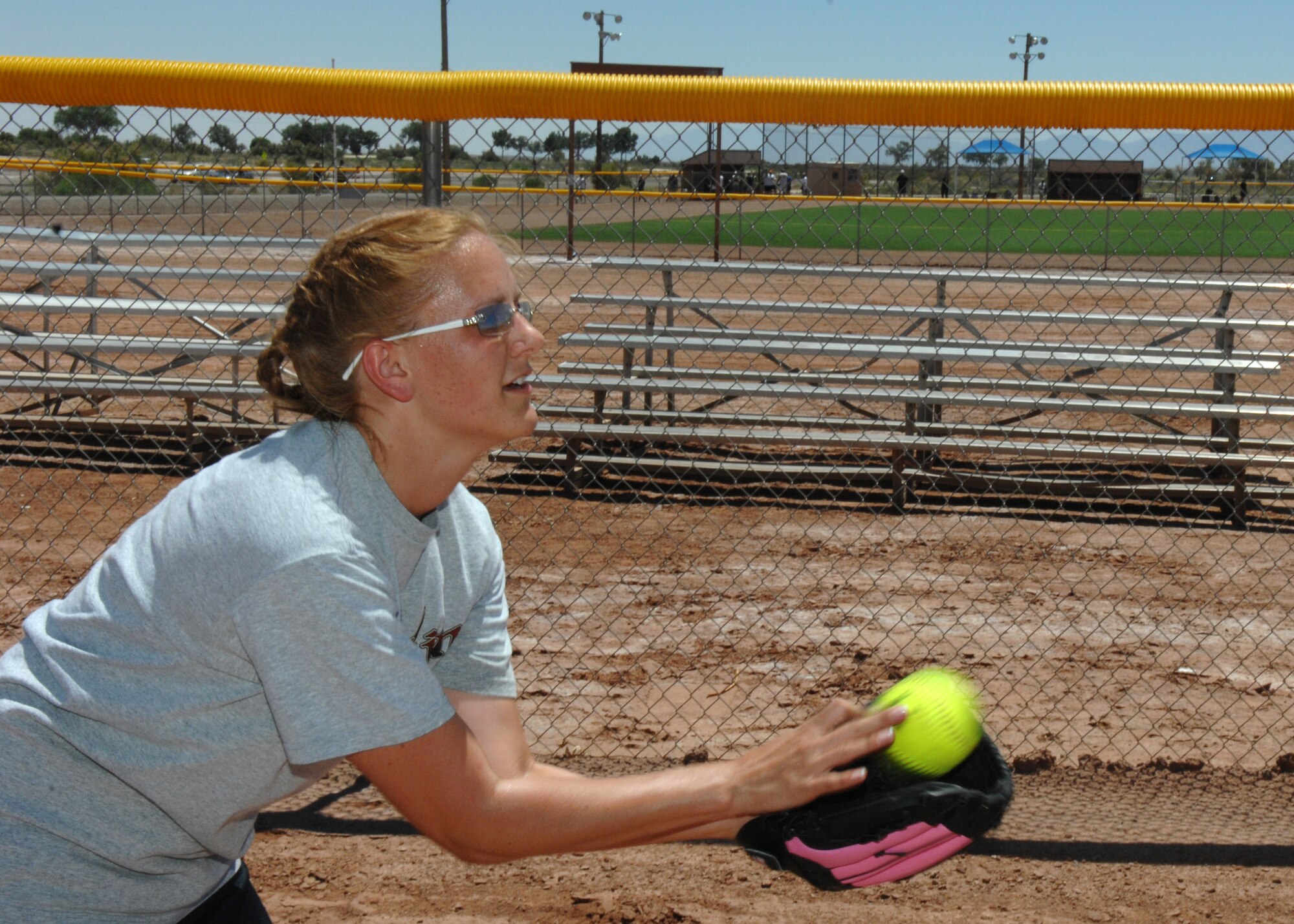 Senior Airman Charlotte Schultz catches a softball before the 46th Test Group's Charity Softball Game June 12 on Holloman Air Force Base, N.M. Airman Schultz is a supply journeymen assigned to the 746th Test Squadron. The 46th Test Group military and civilians raised money for a local non- profit organization in the Alamogordo community. The charity game was in conjunction with their sports day. 
(U.S. Air Force photo/Senior Airman Anthony Nelson Jr)
