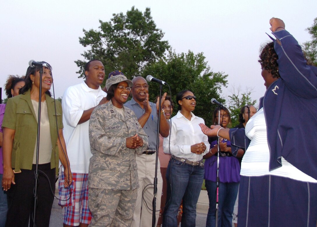 ANDREWS AIR FORCE BASE, Md. -- Andrews Gospel Mass Choir, sings a gospel song in recognition of Andrews Fourth Juneteenth celebration June 13, in front of Chapel 3. Juneteenth, also known as Emancipation Day or Freedom Day, is the oldest known celebration commemorating the ending of slavery in the United States, dating back to June 19, 1865. (U.S. Air Force photo by Bobby Jones)