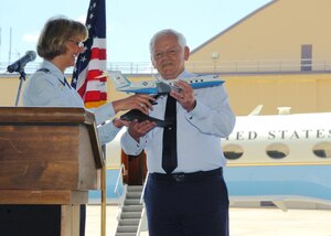 ANDREWS AIR FORCE BASE, Md. -- Brig. Gen. Margaret H. Woodward, 89th Airlift Wing commander, presents Gen. Arthur J. Lichte, Air Mobility Command commander, with a C-37 model airplane to commemorate the arrival of a new C-37B aircraft to the 1st Airlift Squadron during a ceremony June 18, 2008. (U.S. Air Force Photo by Bobby Jones)