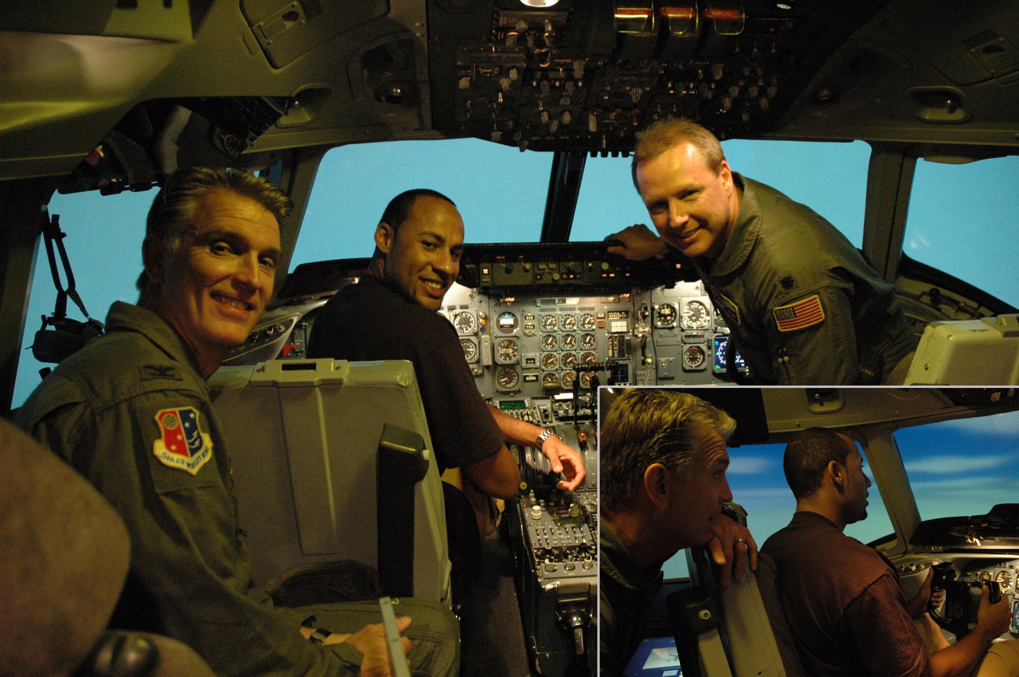 MCGUIRE AIR FORCE BASE, NJ - Col. Giordano B. McMullen Jr., incoming Vice Wing Commander (Left) and Lt. Col. Mark H. Ustaszewski, Chief of Safety (Right) show Hank Baskett,No. 84, Wide Receiver for the Philadelphia Eagles (Center) what it is like training inside a KC-10 simulator. Many people in this area know Baskett was voted as the Eagles special teams MVP in 2007 but few know his parents are Air Force. His father retired as a Chief Master Sgt. after 30 years of service and his mother in in her 37th year working for the Air Force. Baskett spent one of his Saturdays on June 7, visiting with the wing's members and checking out some of our training. (U.S. Air Force photos/Master Sgt. Charles W. Kramer)