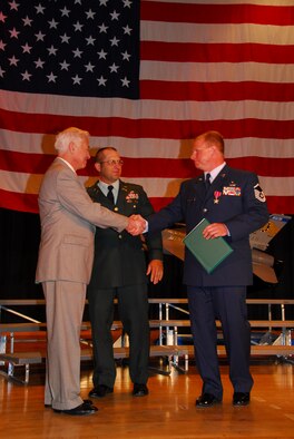 U.S. Air Force Master Sergeant Wayne D. Kettelhut, 148th Fighter Wing Explosive Ordinance (EOD) Specialist, was awarded the Bronze Star Medal with Valor at an awards ceremony in Duluth, Minn. on June 15, 2008.  The award was presented by Major General (retired) Harry J. Sieben (left), Civilian Aide to the Secretary of the Army and Lt Col (retired) Gary Hetrick, US Army who served with MSgt Kettelhut in Iraq during the time he earned his Bronze Star with Valor.  (U.S. Air Force photo by Tech. Sgt. Brett R. Ewald)  (Released)