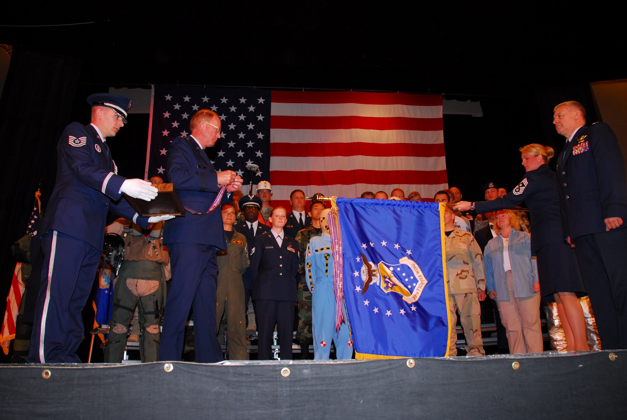 U.S. Air Force Lt Gen Craig McKinley, Director of the Air National Guard presents the 148th Fighter Wing, Duluth, Minn. with the Outstanding Unit Award on June 15, 2008 during an awards ceremony.  The wing received the Outstanding Unit Award for its involvement in multiple deployments in the United States and overseas, high recruiting and retention rates, and exceptional inspection results.  (U.S. Air Force photo by Staff Sgt. Donald Acton)  (Released)