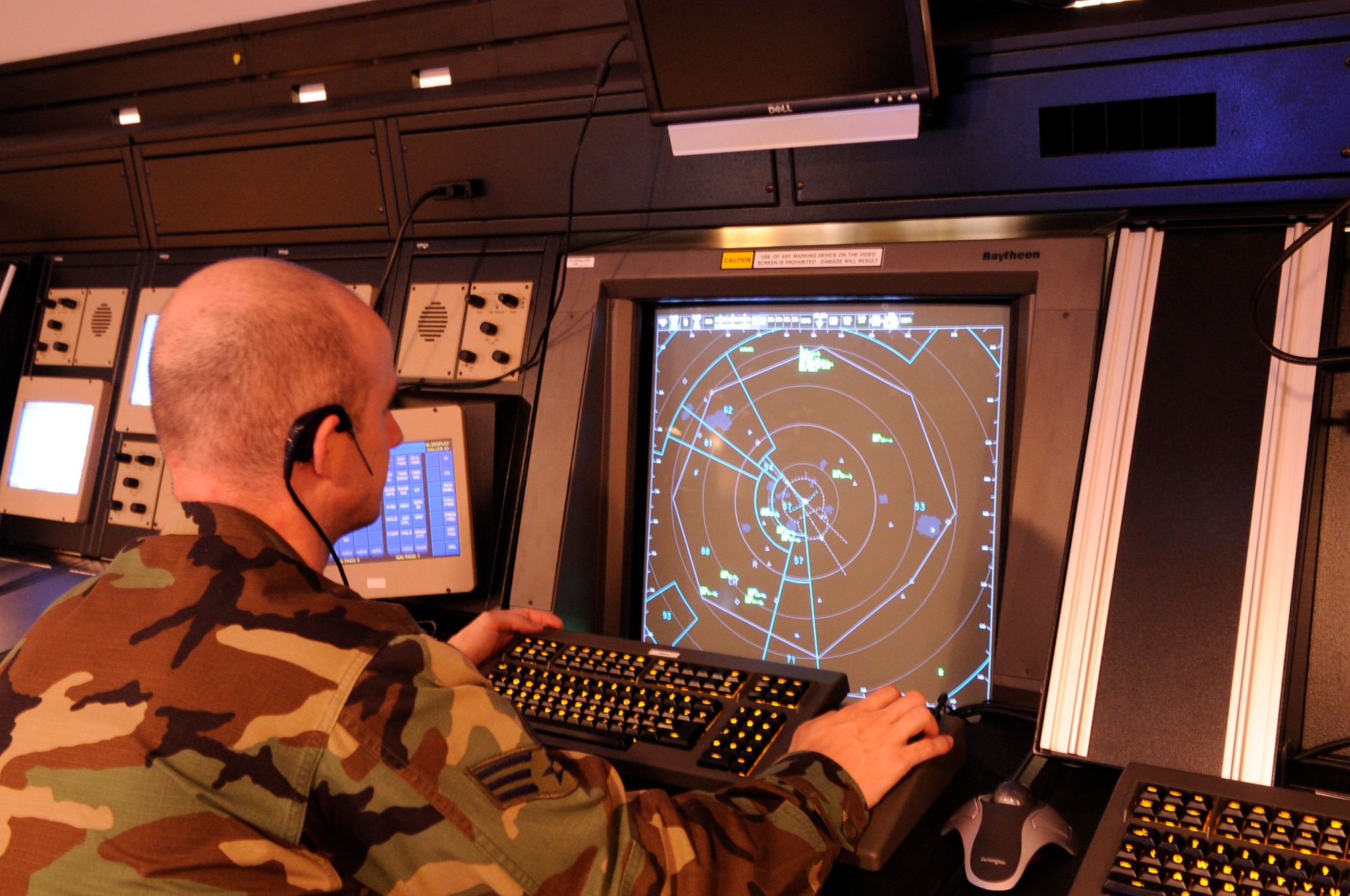Senior Airman Scott Causey examines the new Standard Terminal Automation Replacement System June 17 at Ellsworth Air Force Base, S.D. STARS is a part of the noncontiguous, co-located radar approach control facility. The facility will control both Ellsworth AFB and Minot AFB, N.D. Airman Causey is a 28th Operations Support Squadron air traffic control journeymen. (U.S. Air Force photo/Airman 1st Class Kasey Zickmund) 
