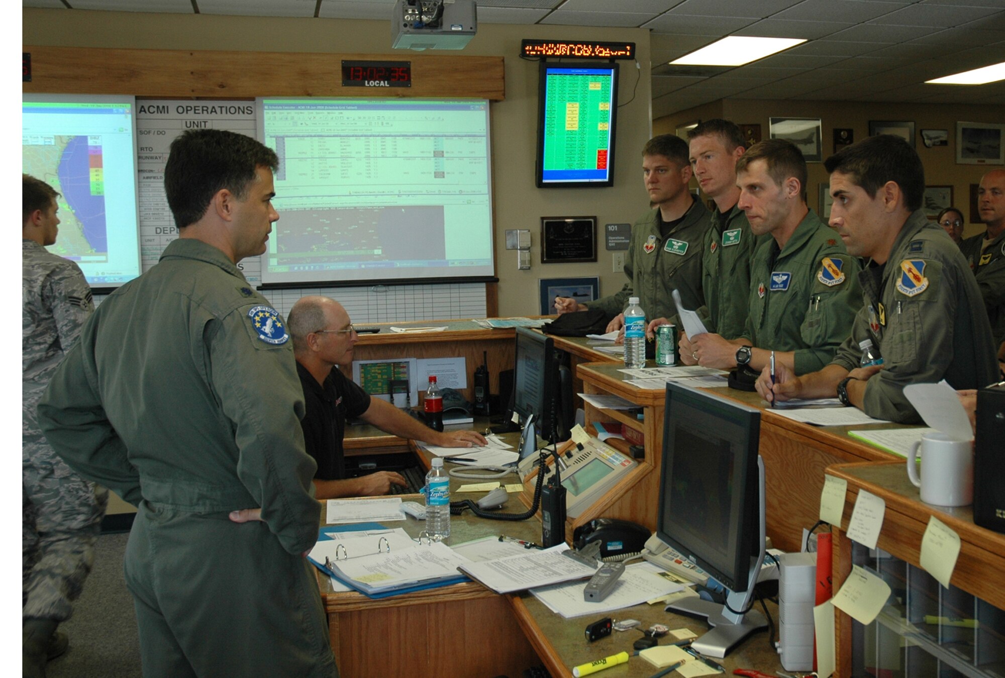Lt. Col. Christopher Didier, 4th Operations Support Squadron assistant director of operations, briefs F-15E Strike Eagle aircrew members prior to takeoff at Tyndall Air Force Base June 18. Members of the 333rd, 334th, 335th and 336th Fighter Squadrons traveled to Tyndall AFB from Seymour Johnson AFB to conduct dissimilar air combat tactics missions against F-22 Raptors assigned to the 43rd Fighter Squadron. The Strike Eagle units will return to Seymour Johnson AFB June 20 after completing nearly 36 DACT sorties against the F-22 Raptor. 
