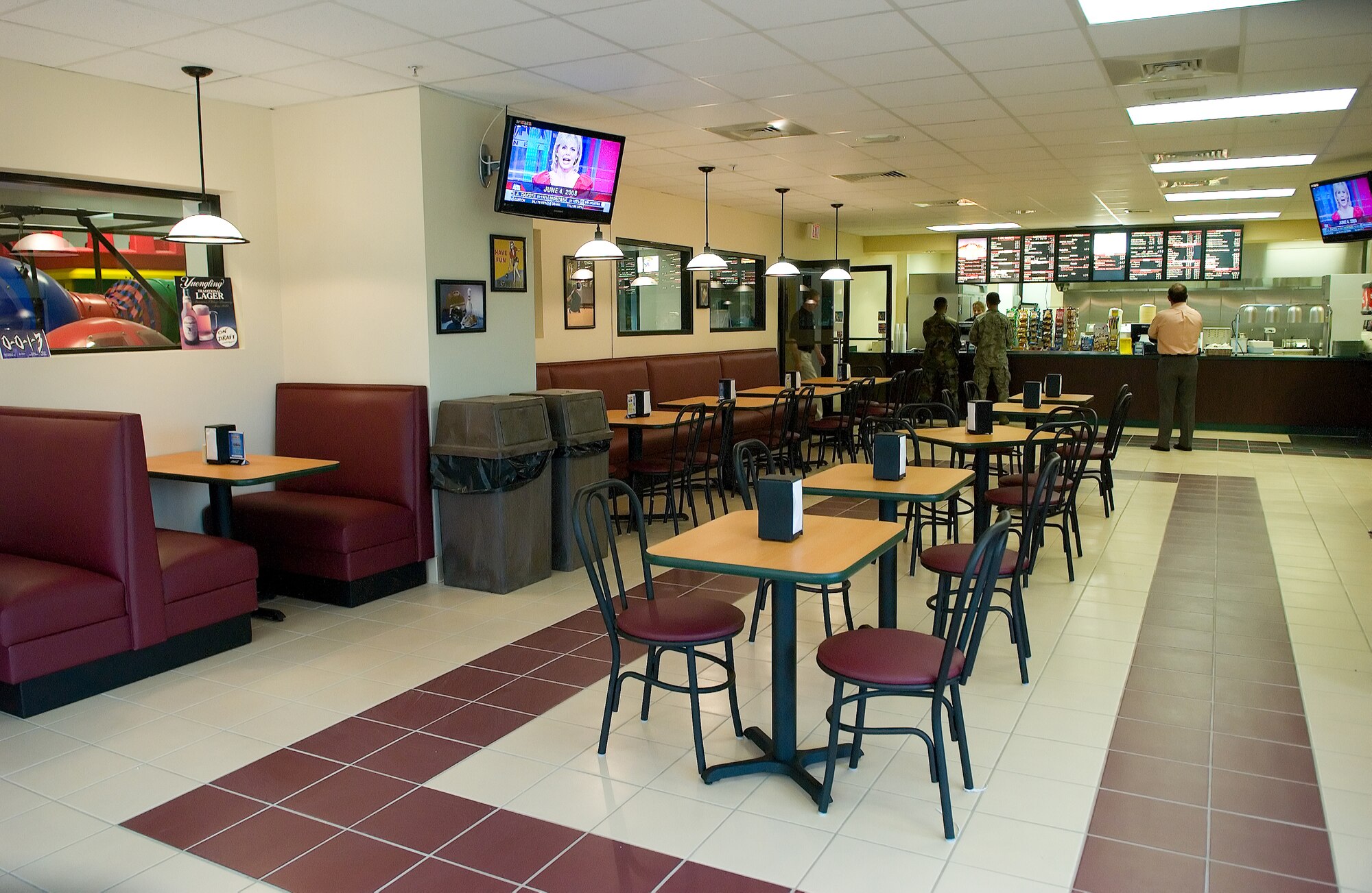 Team Dover Airmen order from the menu at the newly renovated King Pin Café June 4.  The café, located at the Eagle Lanes and Recreation Center, reopened June 4 after renovations were made to the seating, counter and kitchen areas.  (U.S. Air Force Photo by Jason Minto)