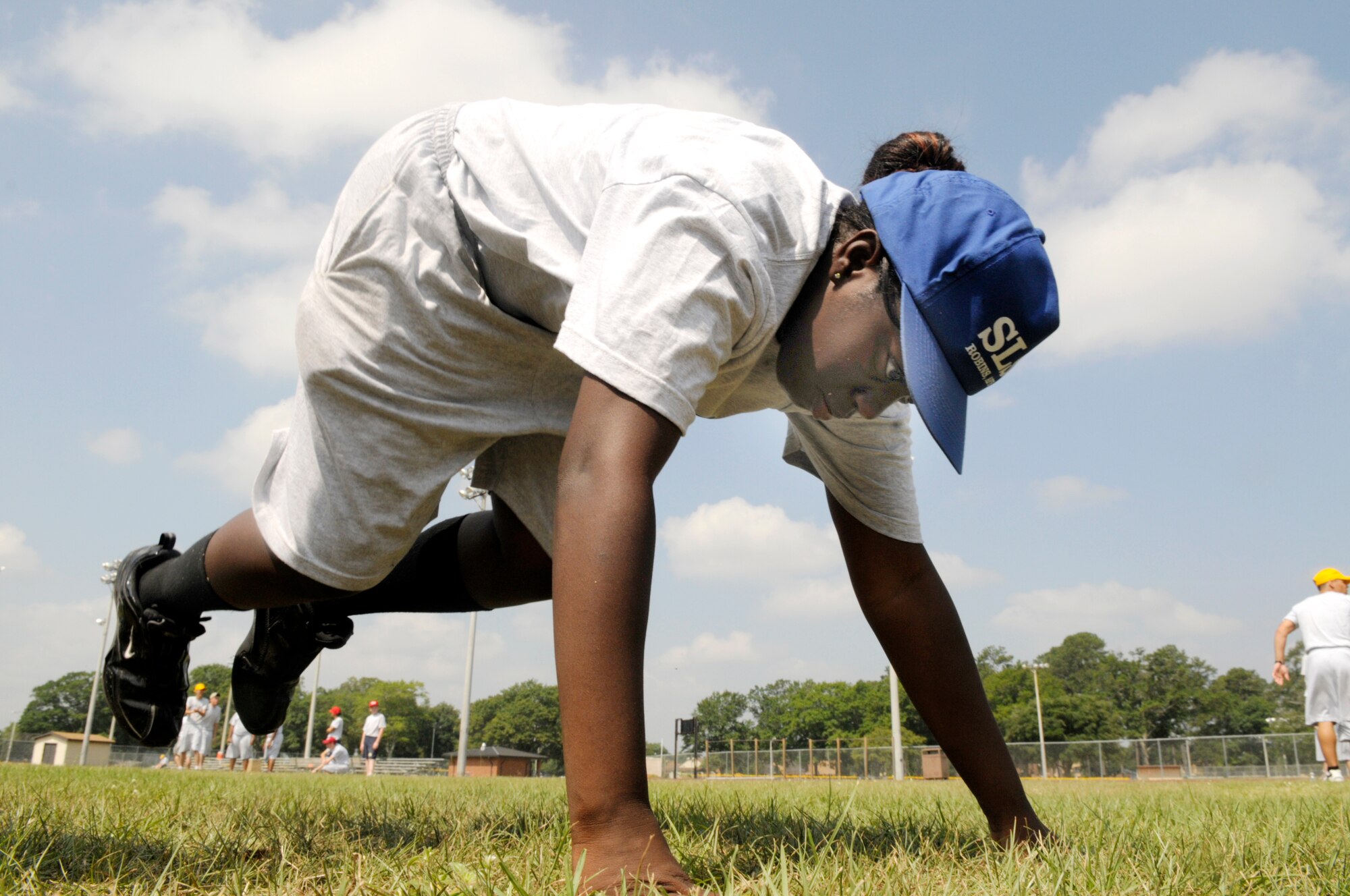 Cadet Tiara Williams, Warner Robins High School, does the body-builder's exercise during confidence course training June 12. U. S. Air Force photo by Sue Sapp