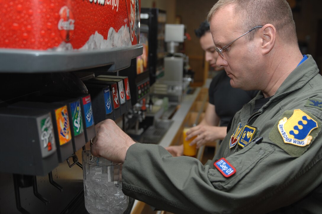 Col. Karl 'Buck' Shawhan, 28th Operations Goup commander, fills a pitcher with water as he serves beverages to Ellsworth Airmen during the Airmen Appreciation Barbecue at the Bandit Inn Dining Facility on Ellsworth Air Force Base, S.D., June 18, 2008. The Airmen Appreciation Barbecue was an opportunity for base leadership to thank Ellsworth Airmen for their service and hard work. (U.S. Air Force photo/Airman 1st Class Joshua Seybert)