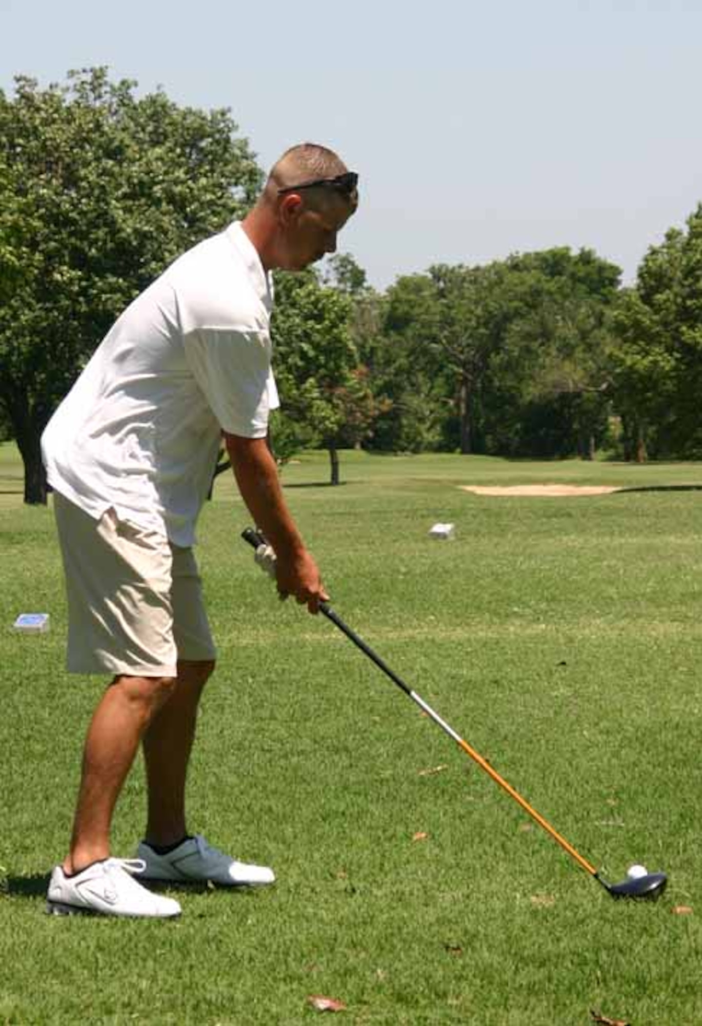 SSgt Eric Jordan, 552 AMXS, tees off while golfing with friends.  (Air Force photo by Kimberly Woodruff)