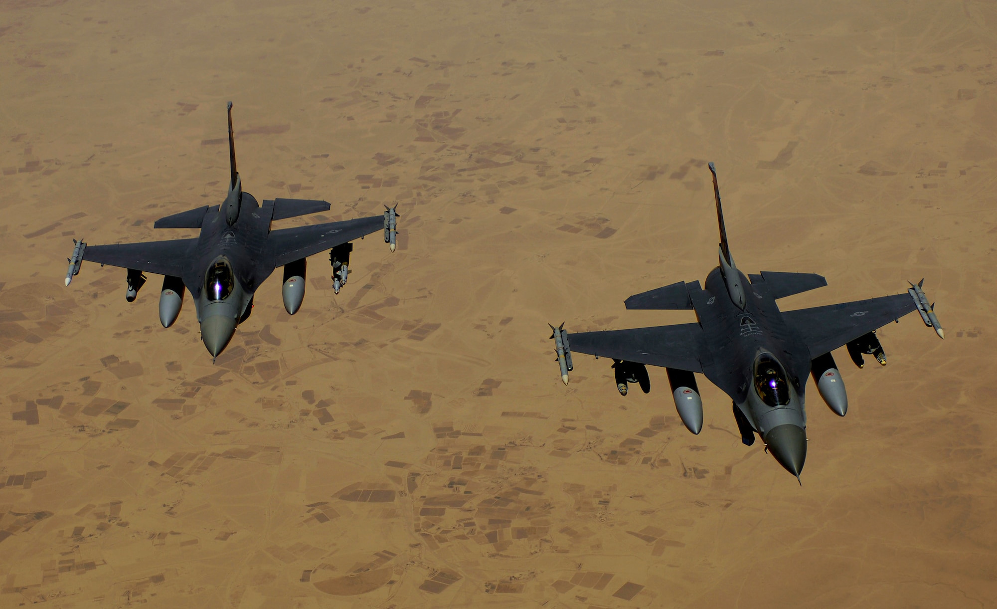 Two Air Force F-16 Fighting Falcons aircraft return to the fight after receiving fuel during a mission over Iraq. F-16s are assigned to Joint Base Balad and is deployed from Hill Air Force Base, Utah. (U.S. Air Force photo/Master Sgt. Andy Dunaway) 