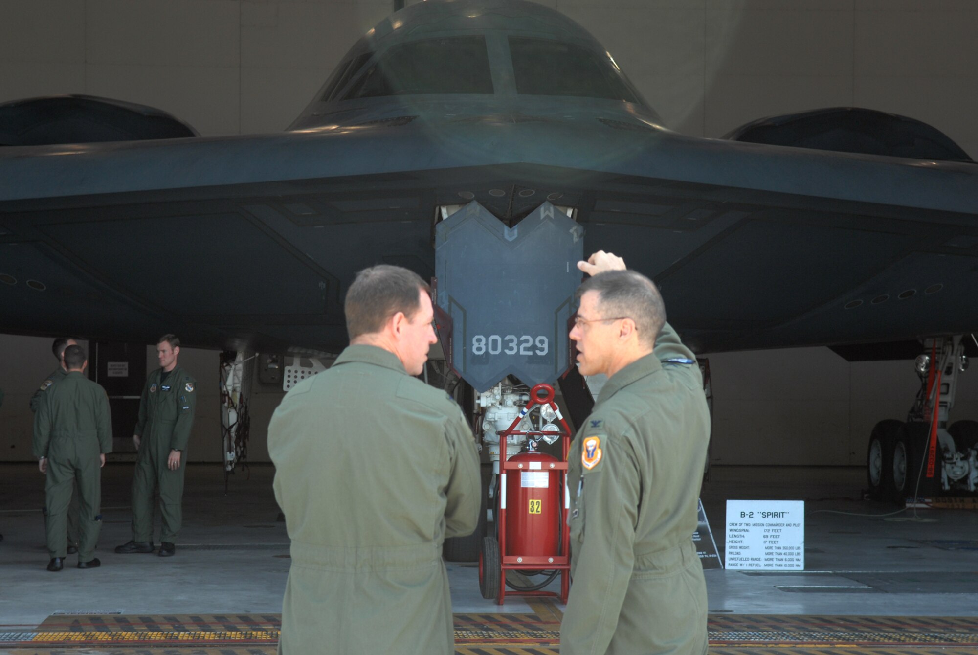 WHITEMAN AIR FORCE BASE, Mo., - Col. Thomas Bussiere, 509th Operations Group commander and Col. James Hecker, 3rd Operations Group commander, discuss the capabilities of their perspective aircraft during a  tour of the Spirit of Missouri June 16. Representatives from Team Whiteman and all the operational F-22 Raptor bases came together for a B-2 and F-22 Integration Conference June 16 through June 19. (U.S. Air Force photo/Airman 1st Class Stephen Linch)