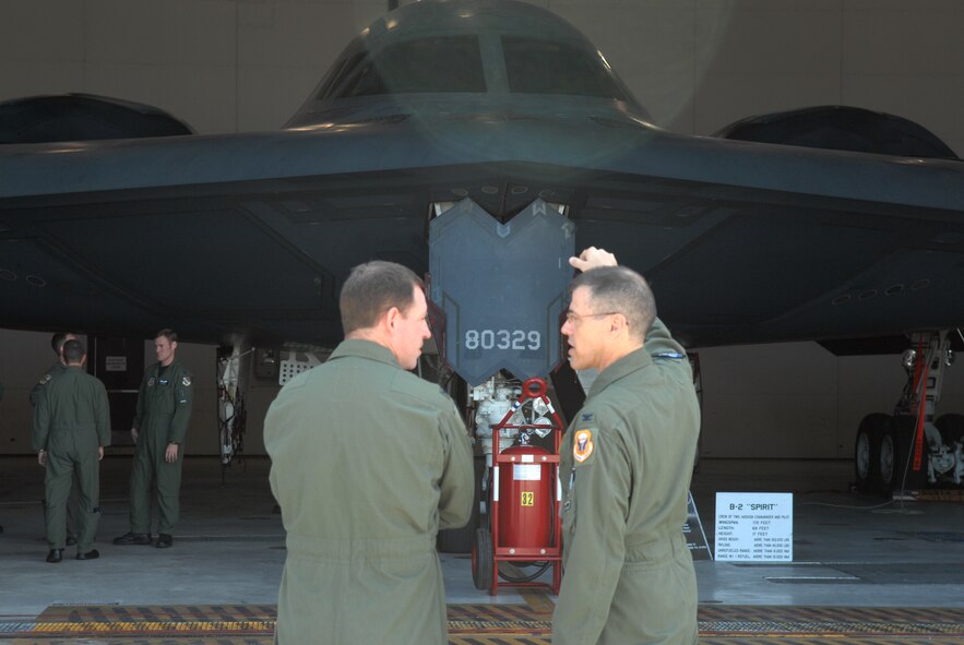 WHITEMAN AIR FORCE BASE, Mo., - Col. Thomas Bussiere, 509th Operations Group commander and Col. James Hecker, 3rd Operations Group commander, discuss the capabilities of their perspective aircraft during a  tour of the Spirit of Missouri June 16. Representatives from Team Whiteman and all the operational F-22 Raptor bases came together for a B-2 and F-22 Integration Conference June 16 through June 19. (U.S. Air Force photo/Airman 1st Class Stephen Linch)