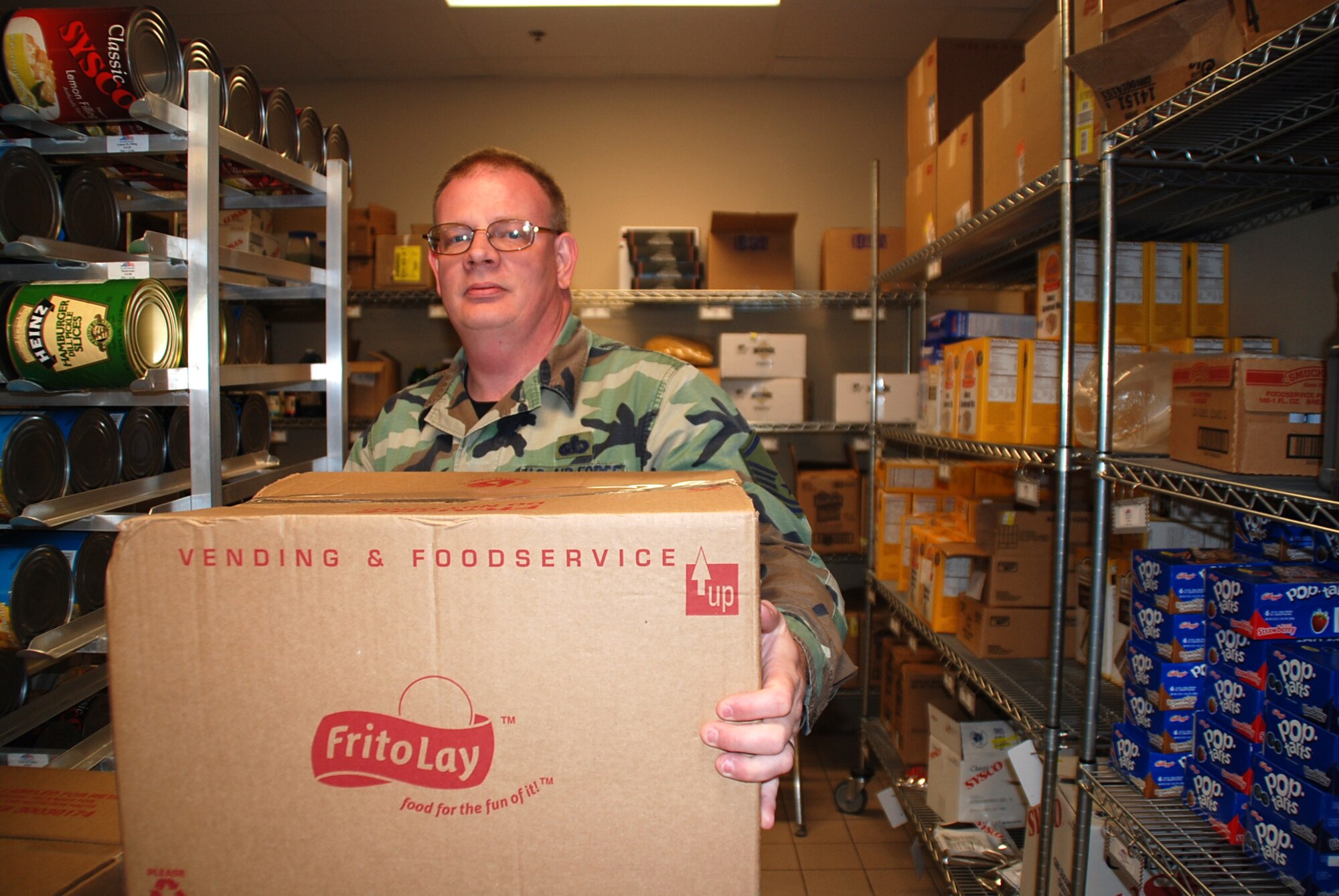 Master Sgt. Edward Updyke works in the storeroom of the Reef Dining Facility at MacDill Air Force Base, Fla., during a deployment there in April 2008.  Sergeant Updyke and other members of the 442nd Services Flight deployed to MacDill AFB for two weeks of annual tour.  The 442nd SVF is part of the 442nd Fighter Wing, an Air Force Reserve unit based at Whiteman AFB, Mo.  (U.S. Air Force photo/Tech. Sgt. Susan Walthour)