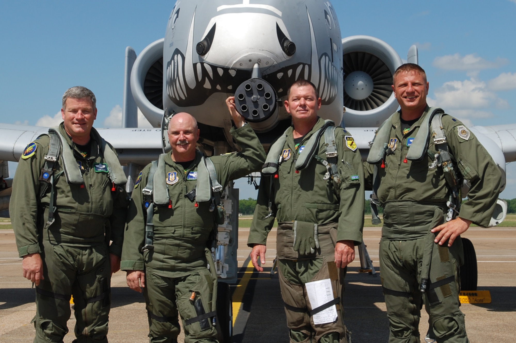 (L to R) Lt Cols Marc Olson, Dave Deaton, James Macaulay, and Brady Glick, 47th Fighter Squadron pilots, get together for a photo following their record setting sorties in the A-10 Thunderbolt II on June 13, 2008, 917th Wing, Barksdale AFB, La. Lt Col Olson accumulated 4,093 flying hours and 2,239 sorties; Lt Col Dave Deaton accumulated a career total of 4,430 flying hours and 2,720 sorties; Lt Col James Macaulay accumulated a career total of 4,551 flying hours and 2,560 sorties; Lt Col Brady Glick accumulated 4,666 flying hours and 2,495 sorties, more than any other pilot flying the A-10. Together, all four pilots have a total of 17,742 flying hours and over 10,000 sorties. (U.S. Air Force photo by Master Sgt. Gregory W. Steele/Released)