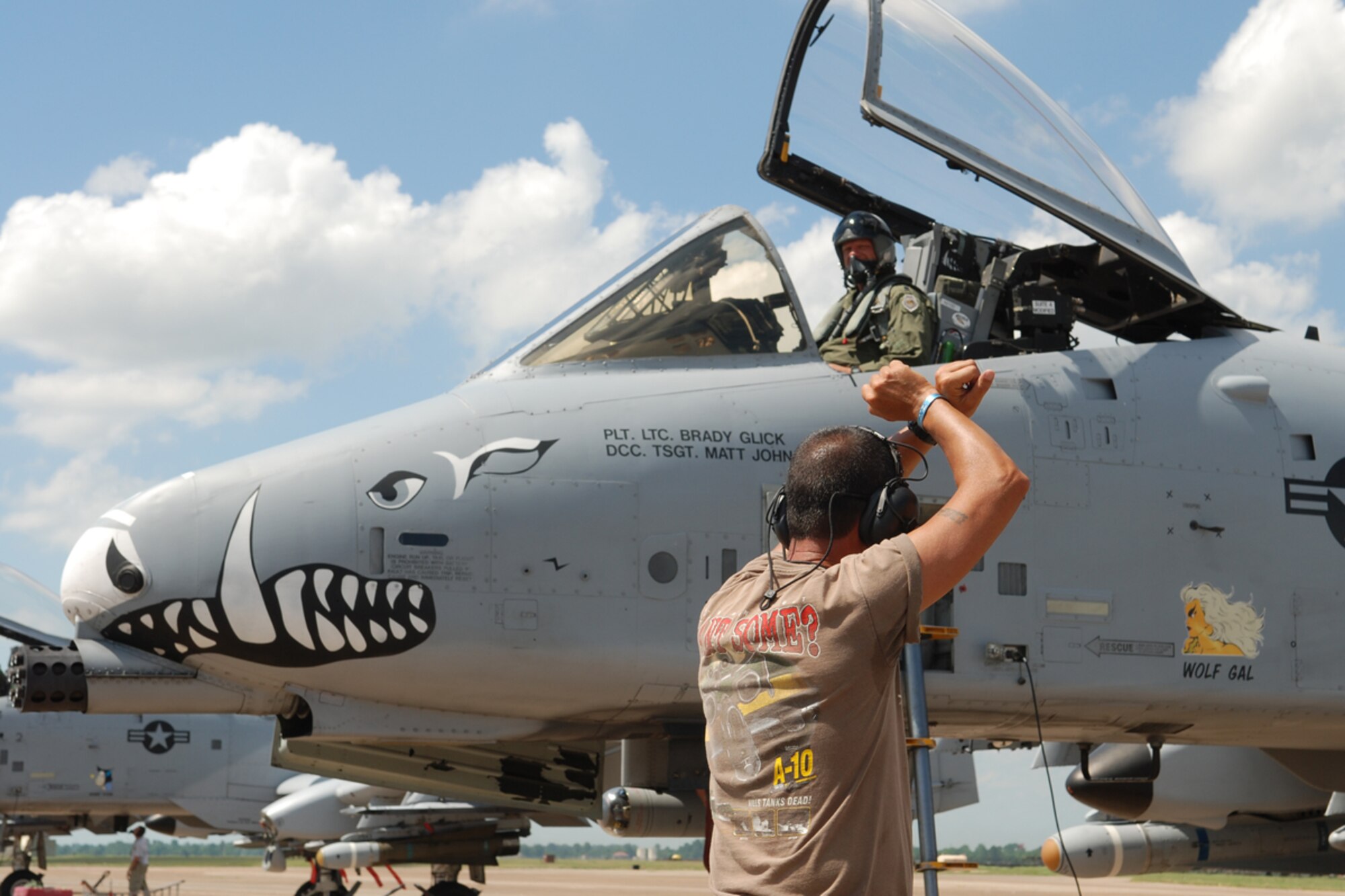 Technical Sgt. Matt Johnson, 717th Aircraft Maintenance Squadron crewchief, marshalls to a stop Lt Col Brady Glick, 47th Fighter Squadron pilot, on June 13, 2008, 917th Wing, Barksdale AFB, La. Lt Col Glick set the single all-time total flying hours record in the A-10 Thunderbolt II with 4,666 flying hours and 2,495 sorties.(U.S. Air Force photo by Master Sgt. Gregory W. Steele/Released)