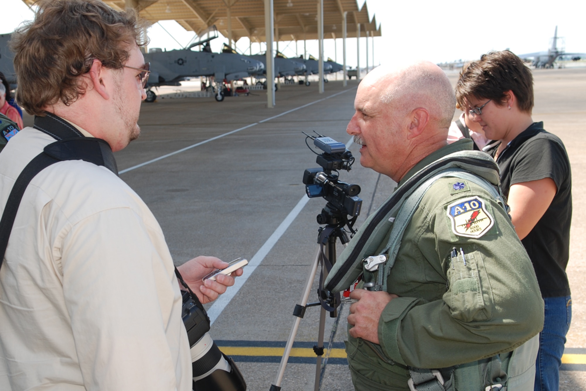 Lt Col Dave Deaton, 47th Fighter Squadron pilot, talks to local media following his return from a record setting sortie in the A-10 Thunderbolt II on June 13, 2008, 917th Wing, Barksdale AFB, La. Lt Col Deaton, along with three other 47th FS pilots, set the accumulated flying hour record in the A-10 with 17,742 flying hours and over 10,000 sorties between them. (U.S. Air Force photo by Master Sgt. Gregory W. Steele/Released)