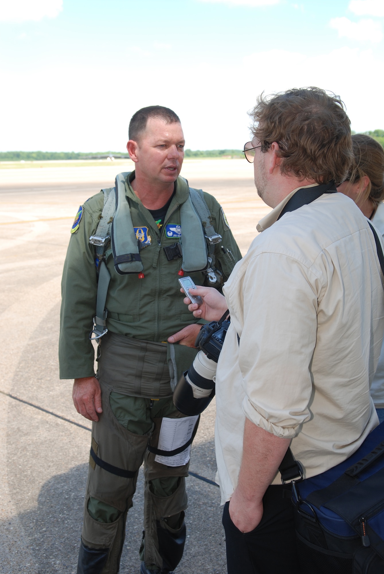 Lt Col James Macaulay, 47th Fighter Squadron commander, talks to local media following his return from a record setting sortie in the A-10 Thunderbolt II on June 13, 2008, 917th Wing, Barksdale AFB, La. Lt Col Macaulay, along with three other 47th FS pilots, set the accumulated flying hour record in the A-10 with 17,742 flying hours and over 10,000 sorties between them. (U.S. Air Force photo by Master Sgt. Gregory W. Steele/Released)