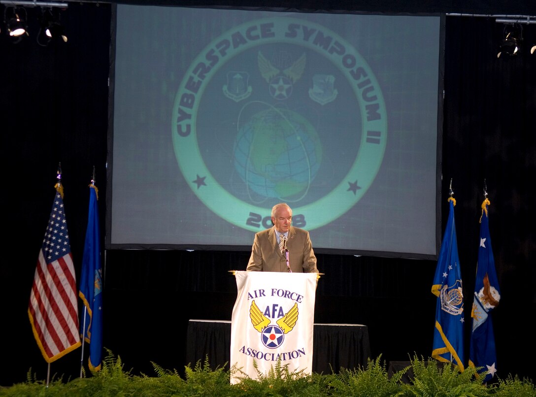 Air Force Secretary Michael W. Wynne addresses the second Cyberspace Symposium in Marlborough, Mass., June 18. (U.S. Air Force photo/Rick Berry)