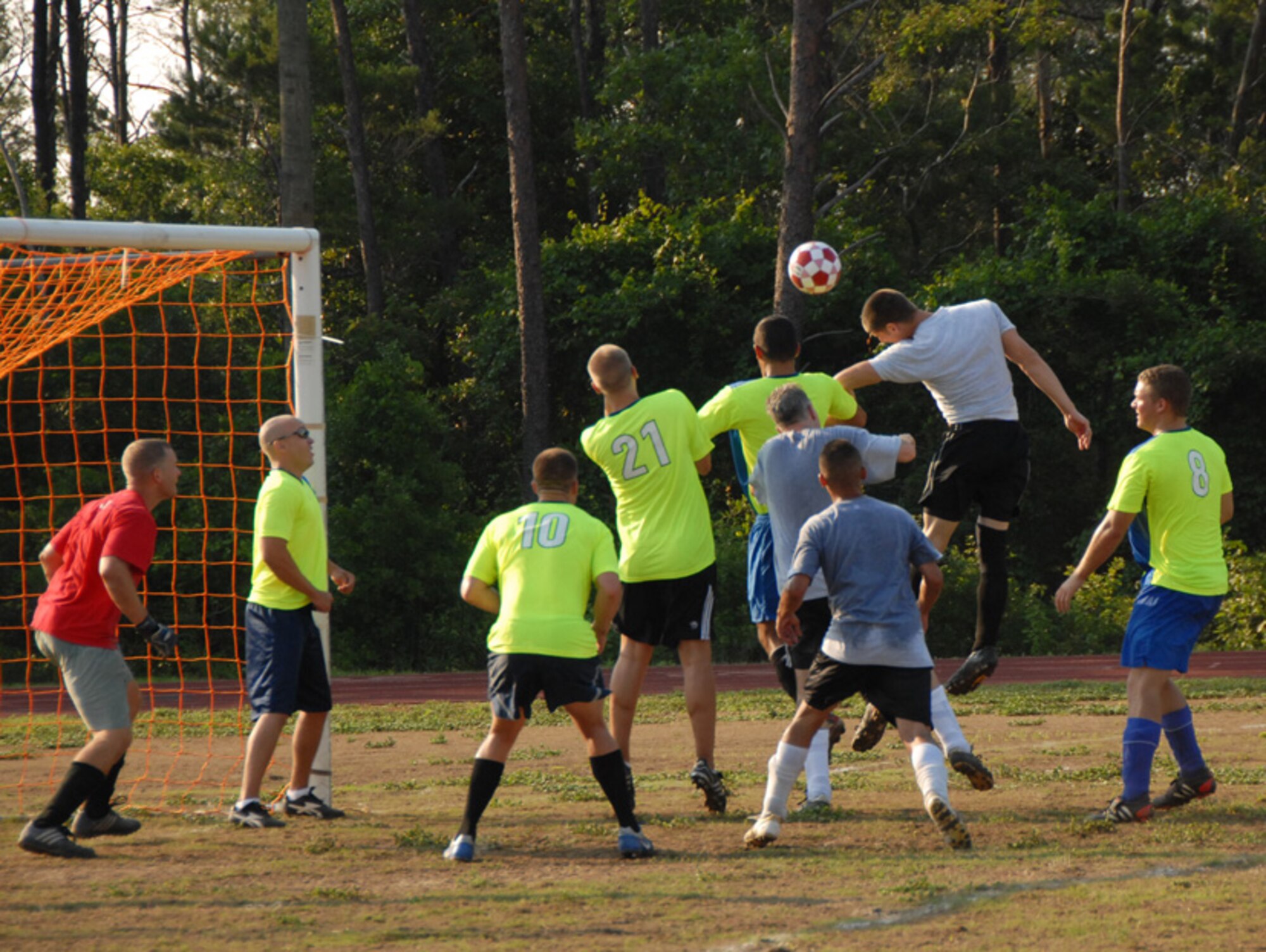 Staff Sgt. Robert O’Bannon, 16th Electronic Warfare Squadron, attempts a header toward the goal after a corner kick during their soccer match with the 68th Electronic Warfare Squadron, June 17 at Eglin Air Force Base, Fla.  The game was evenly matched throughout, with the 68th controlling the ball more in the first half, while the 16th dominated the second.  Ultimately, an error by the 16th forced a goal kick by the 68th, scoring the first and only goal of the game.  Photo by Staff Sgt. Samuel King Jr.