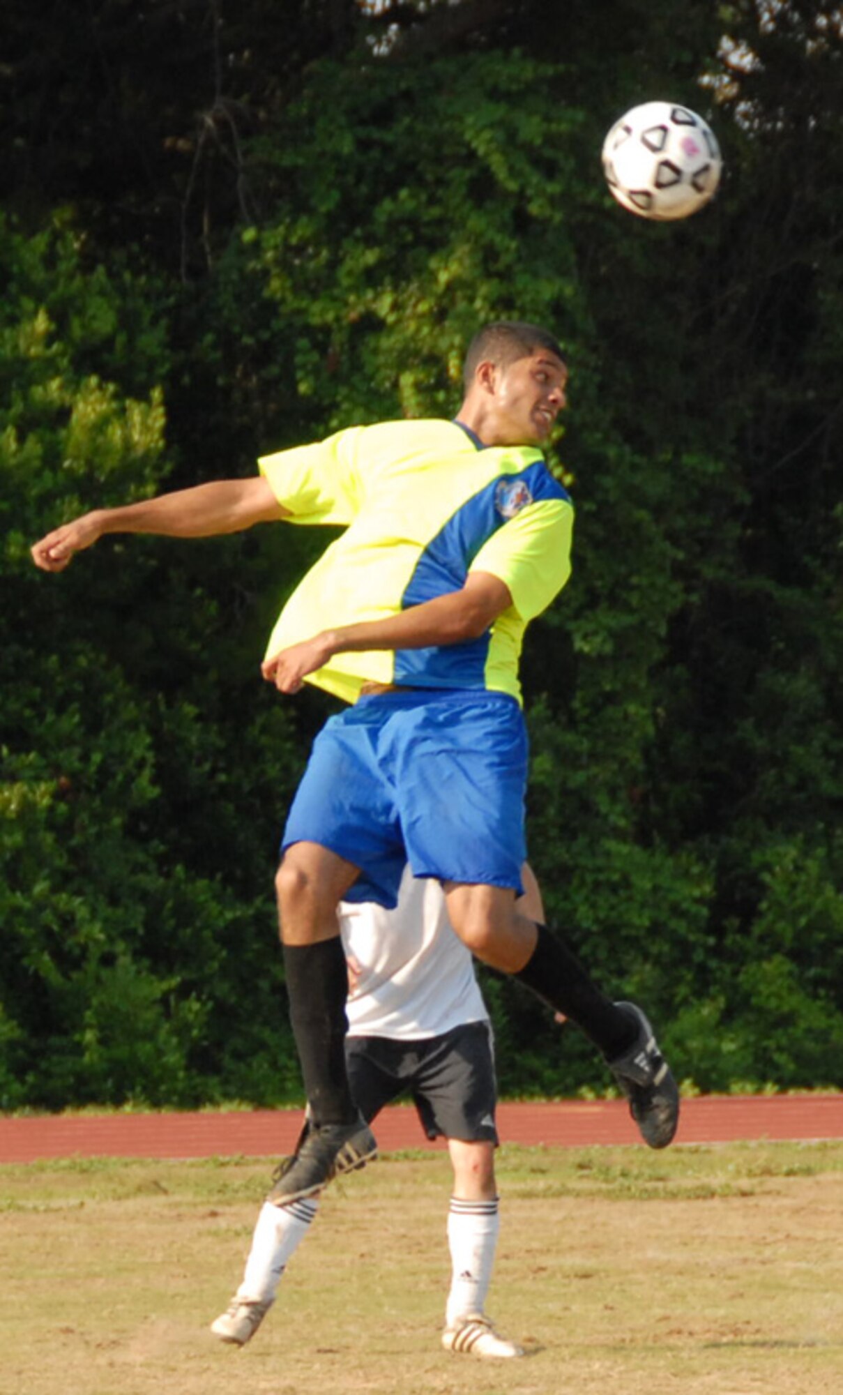 2nd Lt. Abdul Hannan, 68th Electronic Warfare Squadron, uses his head to direct the ball toward the goal during a soccer match with the 16th Electronic Warfare Squadron, June 17 at Eglin Air Force Base, Fla.  The game was evenly matched throughout, with the 68th controlling the ball more in the first half, while the 16th dominated the second.  Ultimately, an error by the 16th forced a goal kick by the 68th, scoring the first and only goal of the game.  Photo by Staff Sgt. Samuel King Jr.