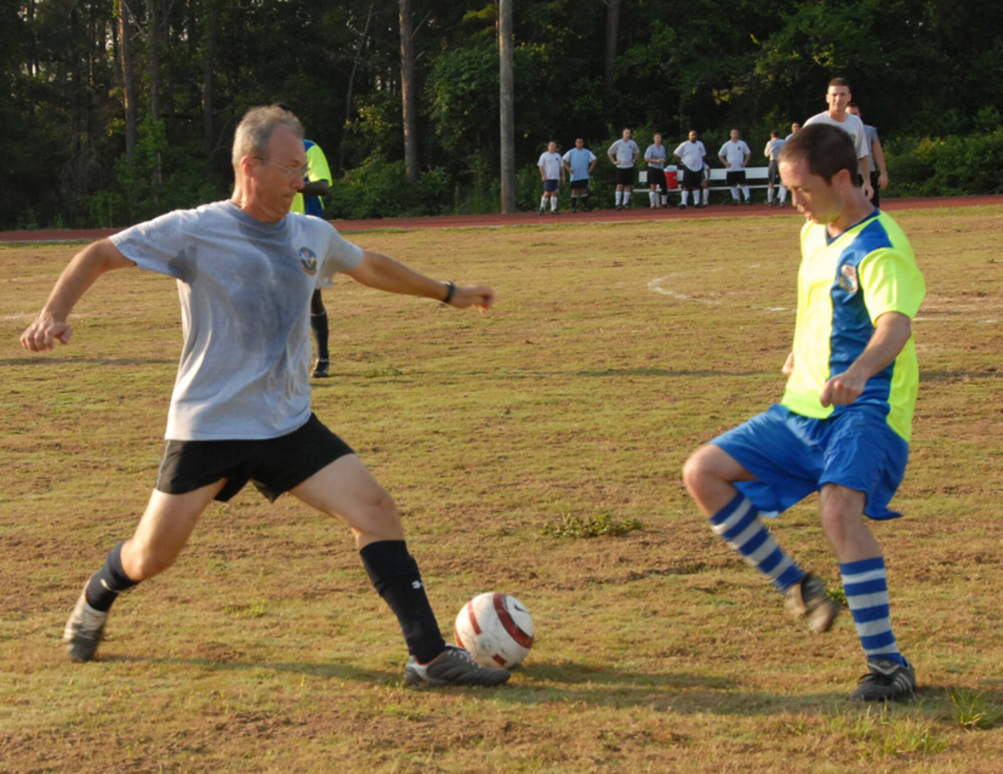 Lt. Col. Dean King, 16th Electronic Warfare Squadron commander, tries to move the ball around Senior Airman Joseph Andrews, 68th Electronic Warfare Squadron, during a soccer match June 17 at Eglin Air Force Base, Fla.  The two squadrons are perennial rivals and are constantly competing for the top spot in 53d and Electronic Warfare Group morale and sporting events.  The game came down to a goal kick by the 68th for the win.  The score was 1-0.  