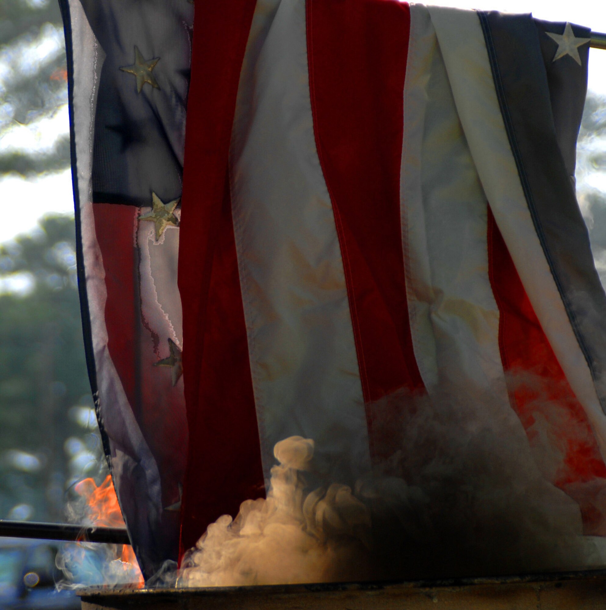 SEYMOUR JOHNSON AIR FORCE BASE, N.C. - A worn, tattered American flag is ceremoniously burned, June 14, 2008. U.S. flags were burned as part of a flag retirement ceremony, which shows respect and honor to the flags being retired. (U.S. Air Force photo by Airman 1st Class Makenzie R. Lang)