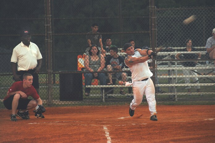 Christopher Saydeh makes another base hit for the 437th Security Forces Squadron while playing against the 437th Communications Squadron in a softball game June 17. (U.S. Air Force photo/Airman 1st Class Cynthia Spalding) 