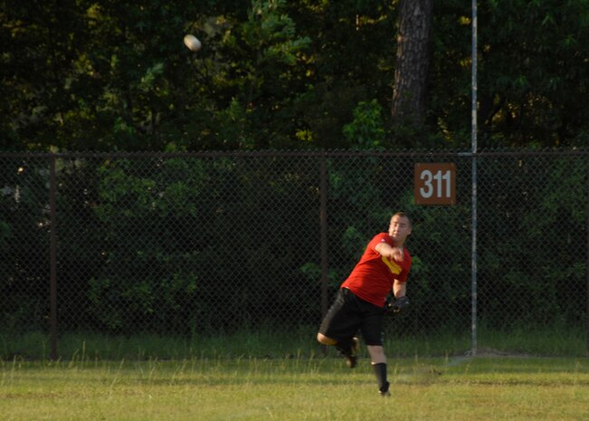 Andrew Hopp throws a ball in after catching it while playing an outfield position for the 437th Communications Squadron June 17. (U.S. Air Force photo/Airman 1st Class Cynthia Spalding) 
