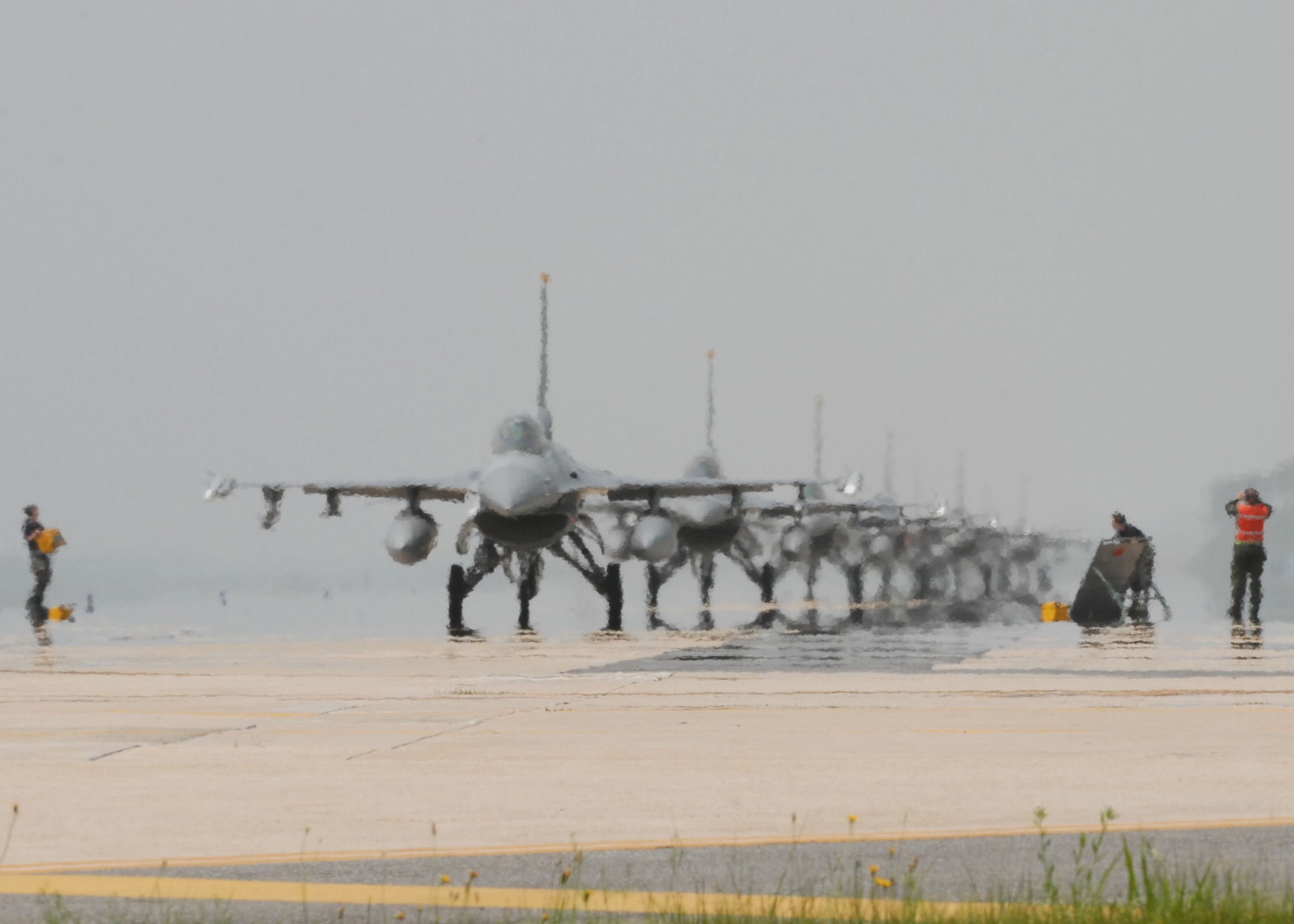 KUNSAN AIR BASE, Republic of Korea—a line of F-16s from the 80th Fighter Squadron taxi here during the Max Thunder exercise June 19. Training side-by-side is part of day-to-day operations for ROKAF and USAF forces at Kunsan Air Base. The bi-lateral training received during Max Thunder will not improve interoperability, but is also intended to assist the ROKAF prepare for RED FLAG Nellis in August 2008.  
(U.S. Air Force Photo/Staff Sgt Araceli Alarcon)
