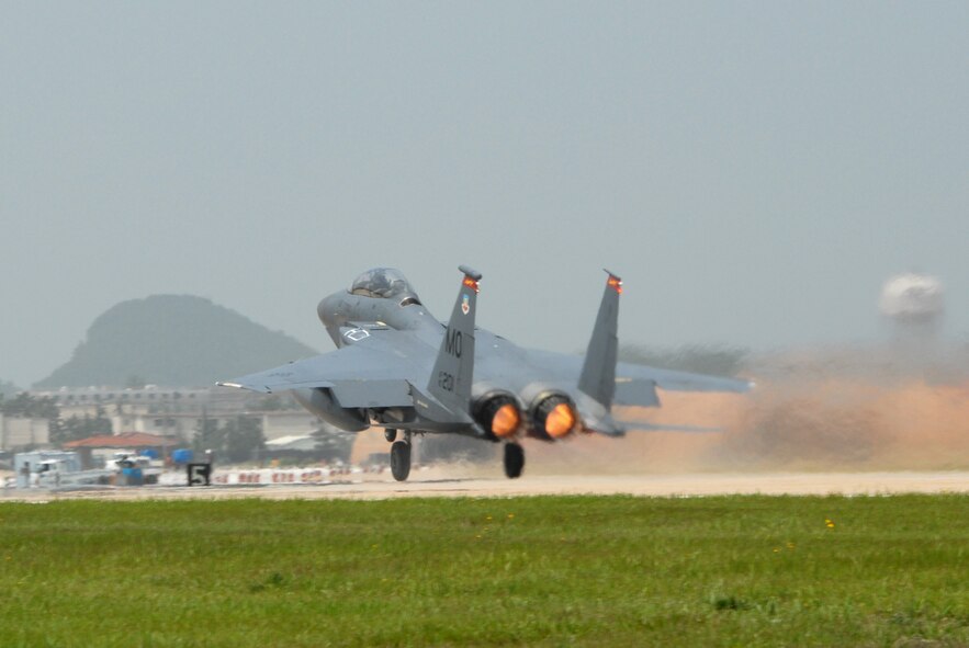 KUNSAN AIR BASE, Republic of Korea--An F-15E Strike Eagle from Mountain-Home Air Force Base, Idaho, takes off during exercise Max Thunder 08-01 here June 19. Training side-by-side is part of day-to-day operations for ROKAF and USAF forces at Kunsan Air Base. The bi-lateral training received during Max Thunder will not only improve interoperability, but is also intended to assist the ROKAF prepare for RED FLAG Nellis in August 2008. (US Air Force photo by: Senior Airman Angela Ruiz) 
   



