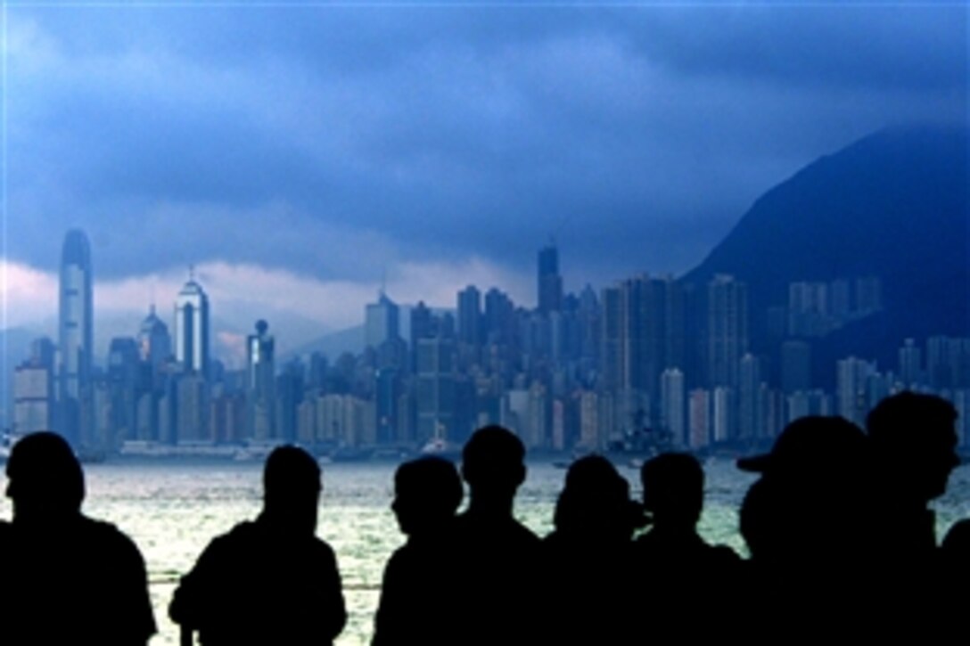 U.S. sailors gather in a hangar bay aboard the aircraft carrier USS Ronald Reagan as the ship approaches Hong Kong for a port visit, June 19, 2008. The Ronald Reagan Carrier Strike Group is on a routine deployment in the U.S. 7th Fleet area of responsibility in the western Pacific and Indian oceans. 